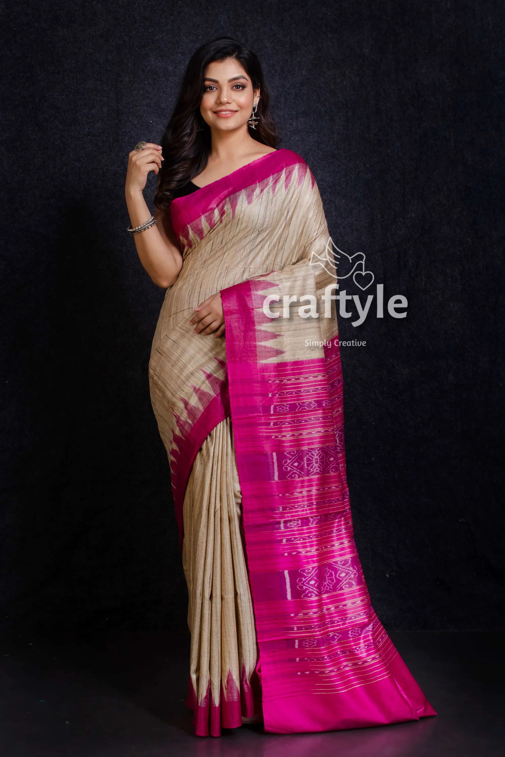 Beige and magenta handwoven sambalpuri ikat tussar ghicha silk saree woman wears beige fuchsia silk 1