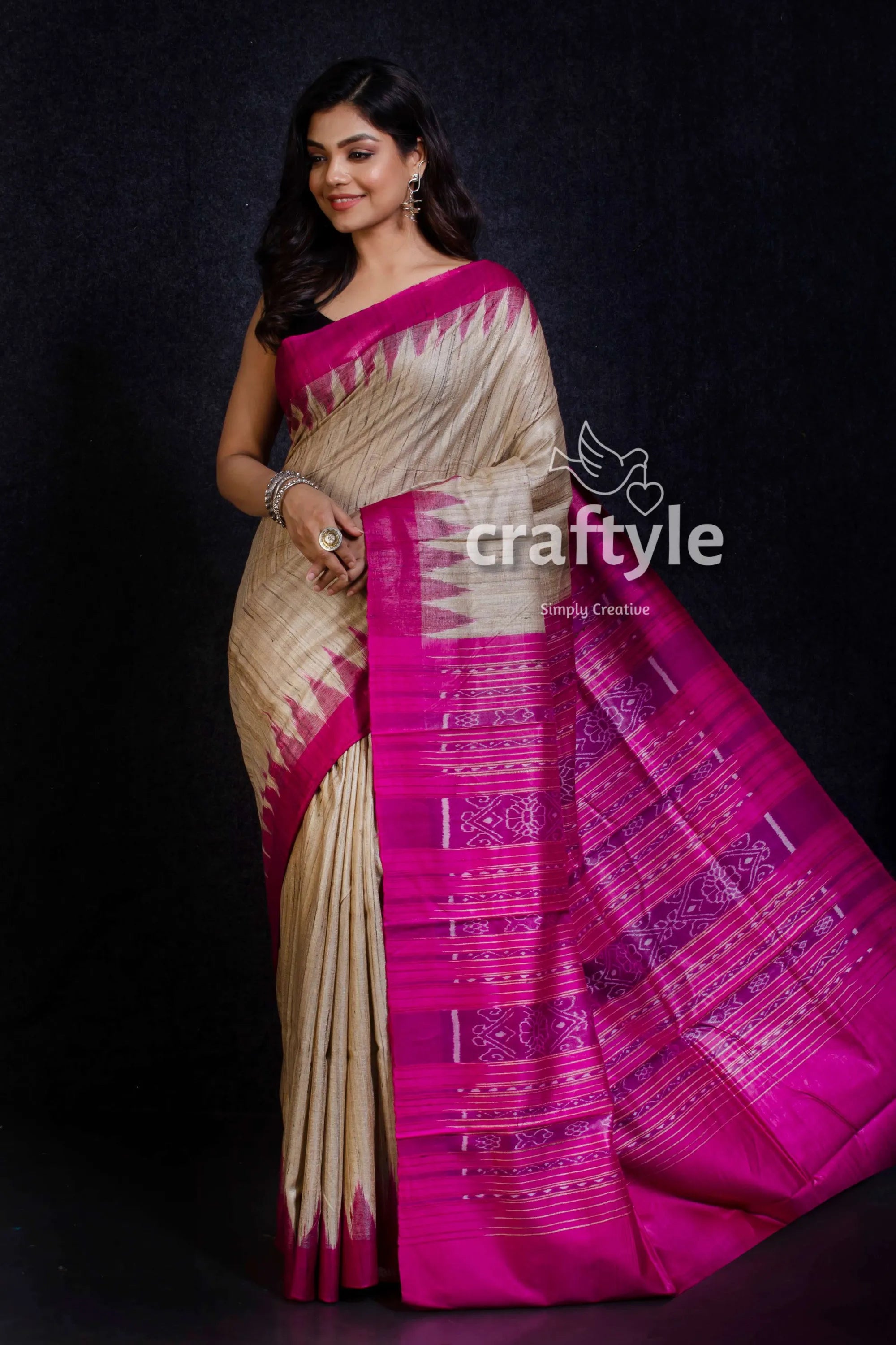 Beige and magenta handwoven sambalpuri ikat tussar ghicha silk saree woman wears traditional silk saree 2