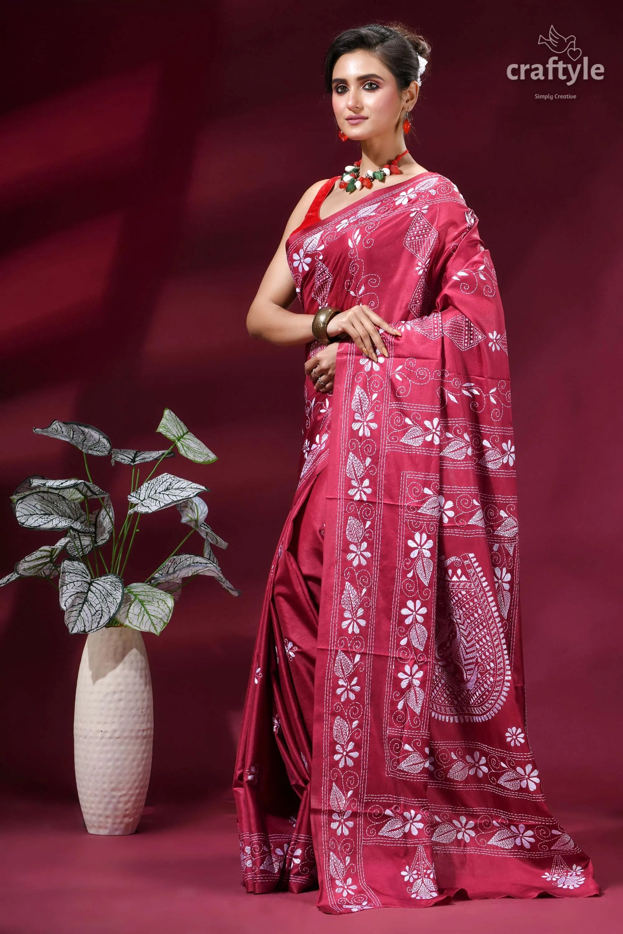 Cerise pink fish motif handcrafted silk kantha stitch saree woman wears vibrant red saree 3