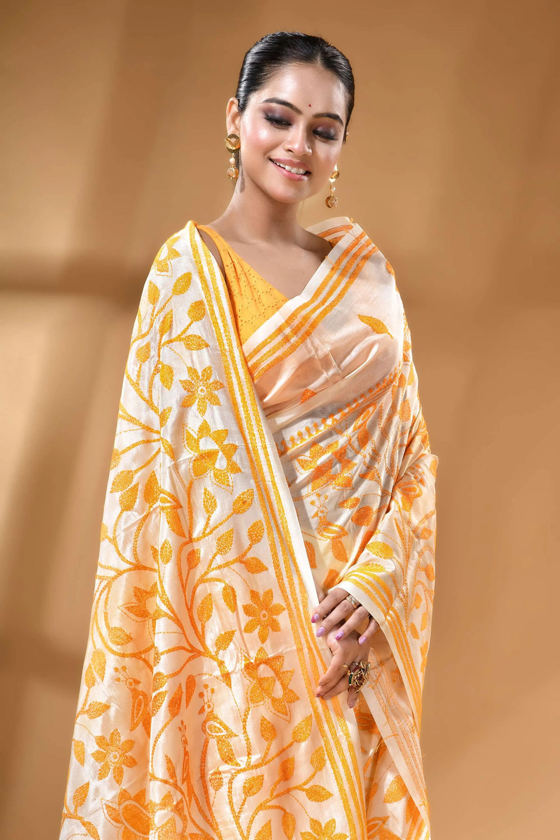 Daisy white orange thread floral silk kantha stitch saree woman wears cream gold floral-patterned 2