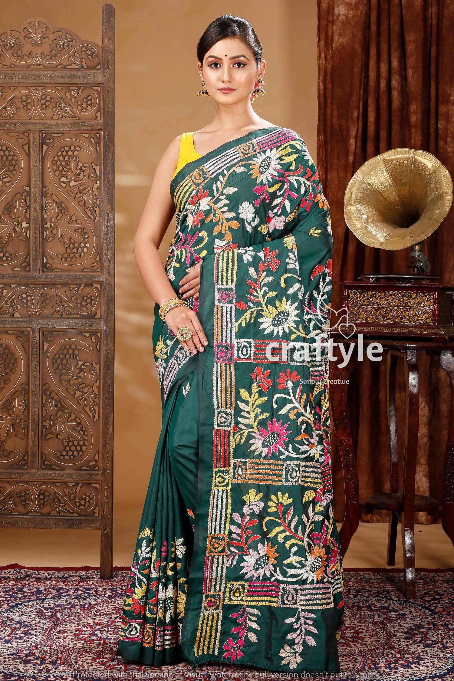 Deep green artisanal silk kantha saree green floral embroidered saree 1