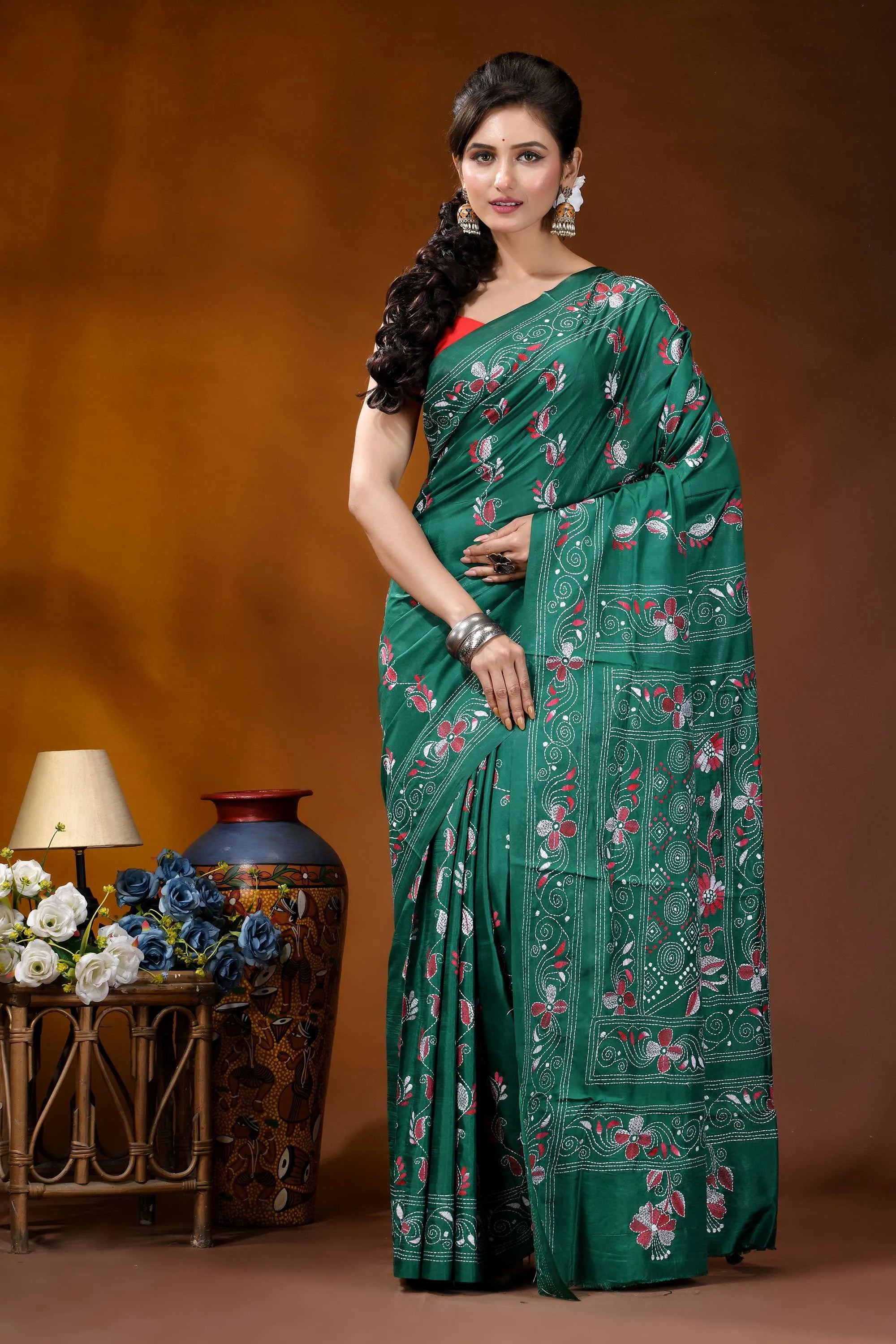 Deep sea green silk kantha stitch saree - hand embroidered floral design woman wears vibrant emerald green 1