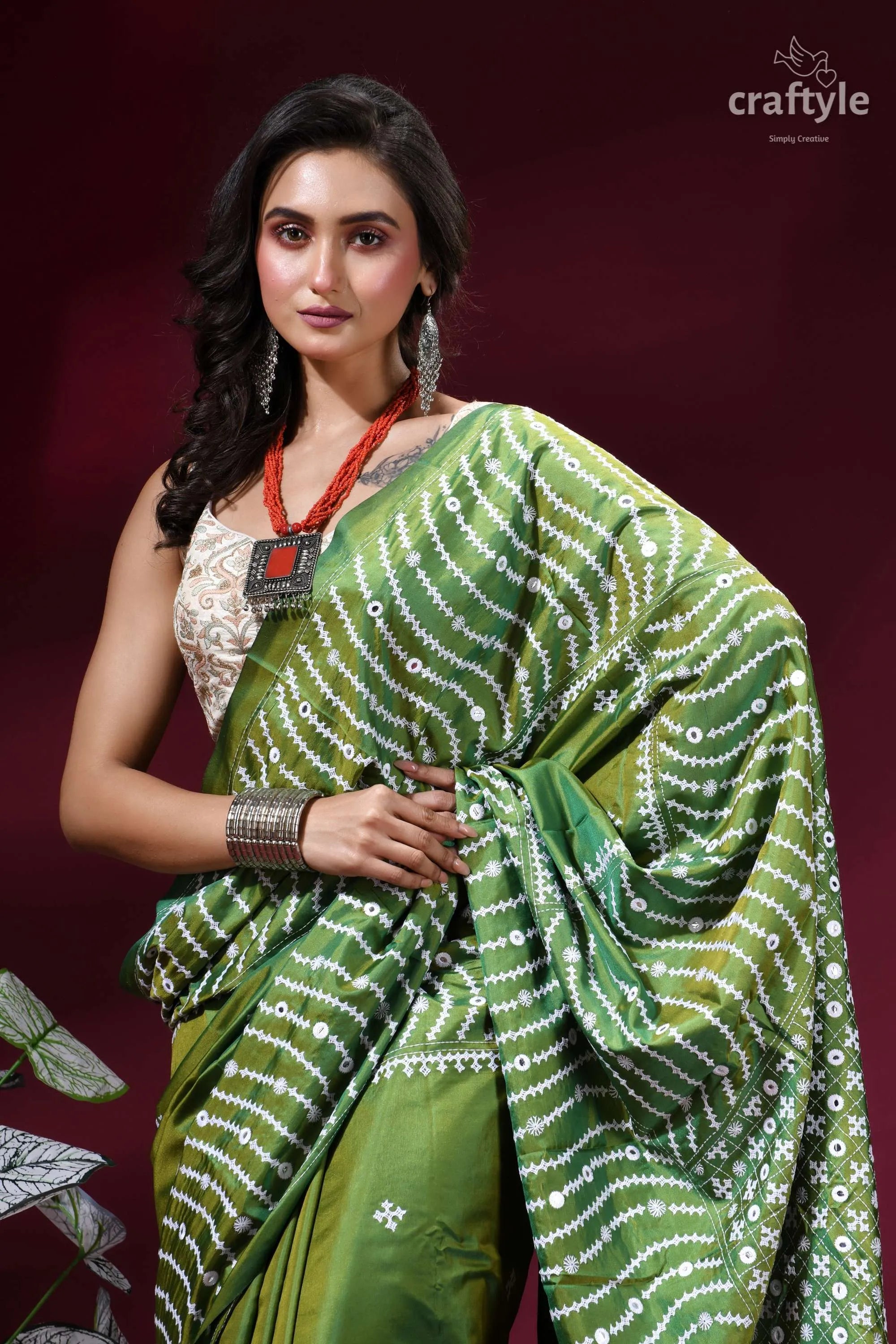 Drab green intricate gujrati stitch silk saree with mirror work green silk saree white geometric 2