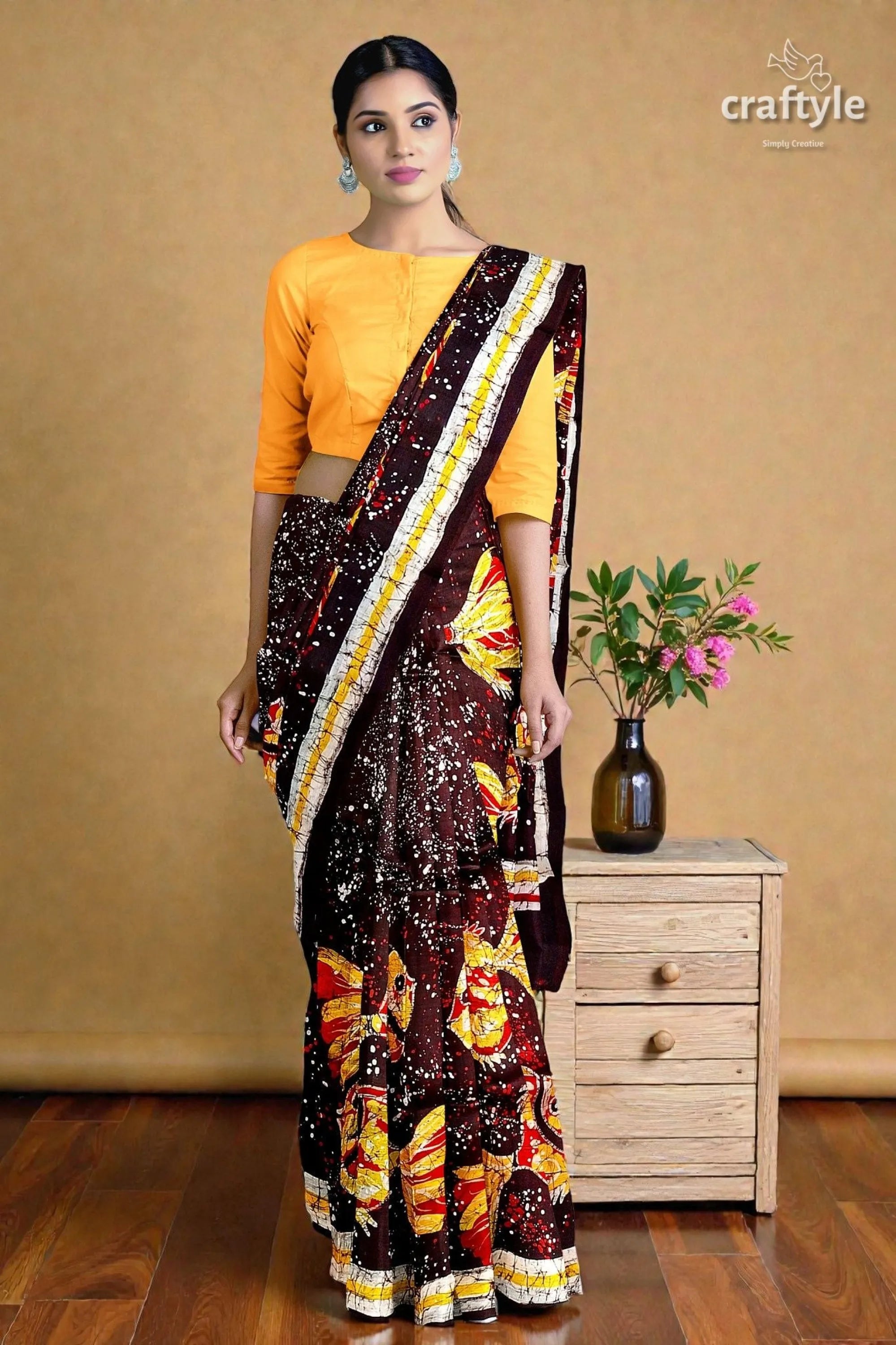 Fish motif hand batik pure mulberry silk saree - woman wears vibrant patterned saree 3