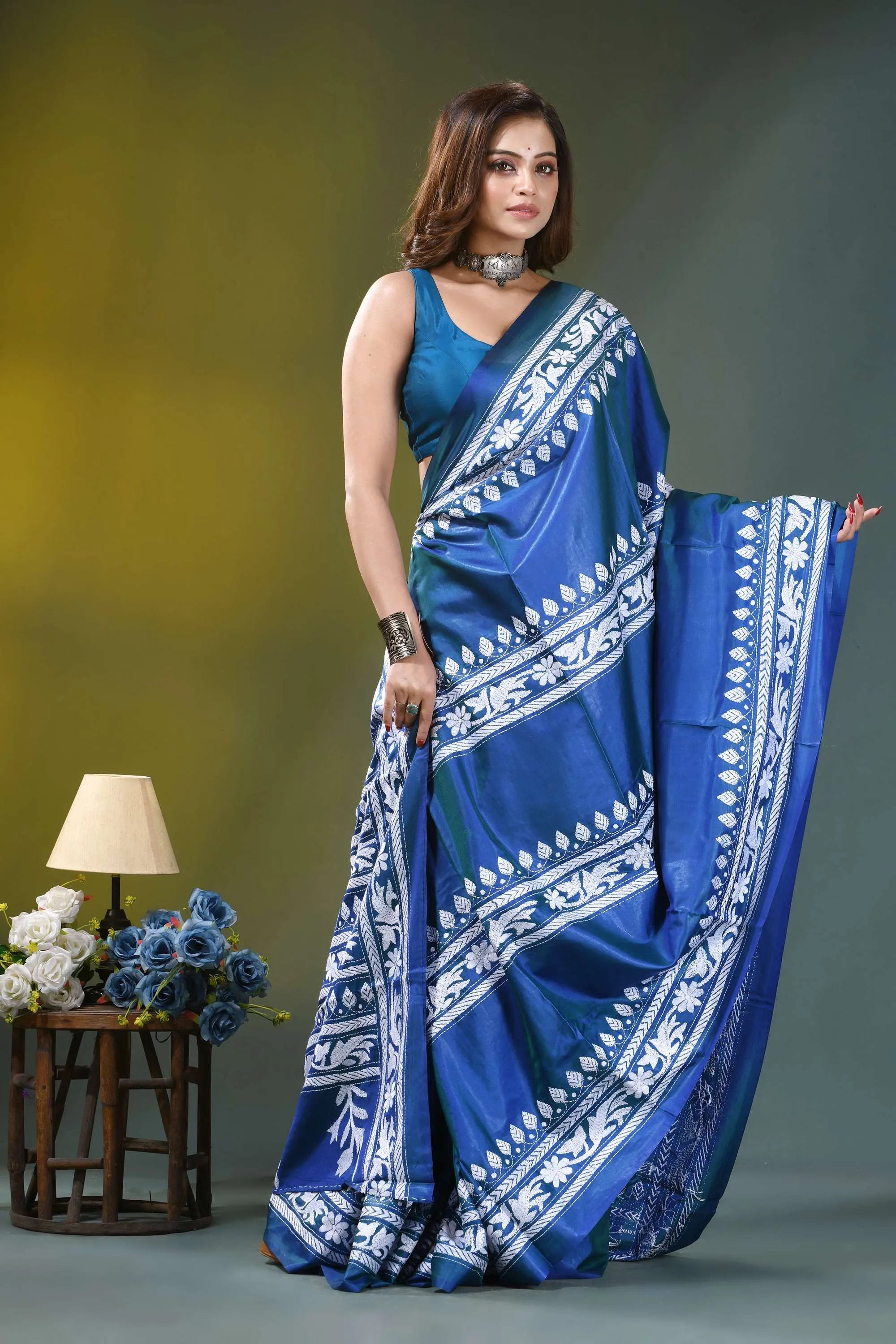 Fun blue handcrafted floral motif silk kantha stitch saree woman wears vibrant royal blue 4