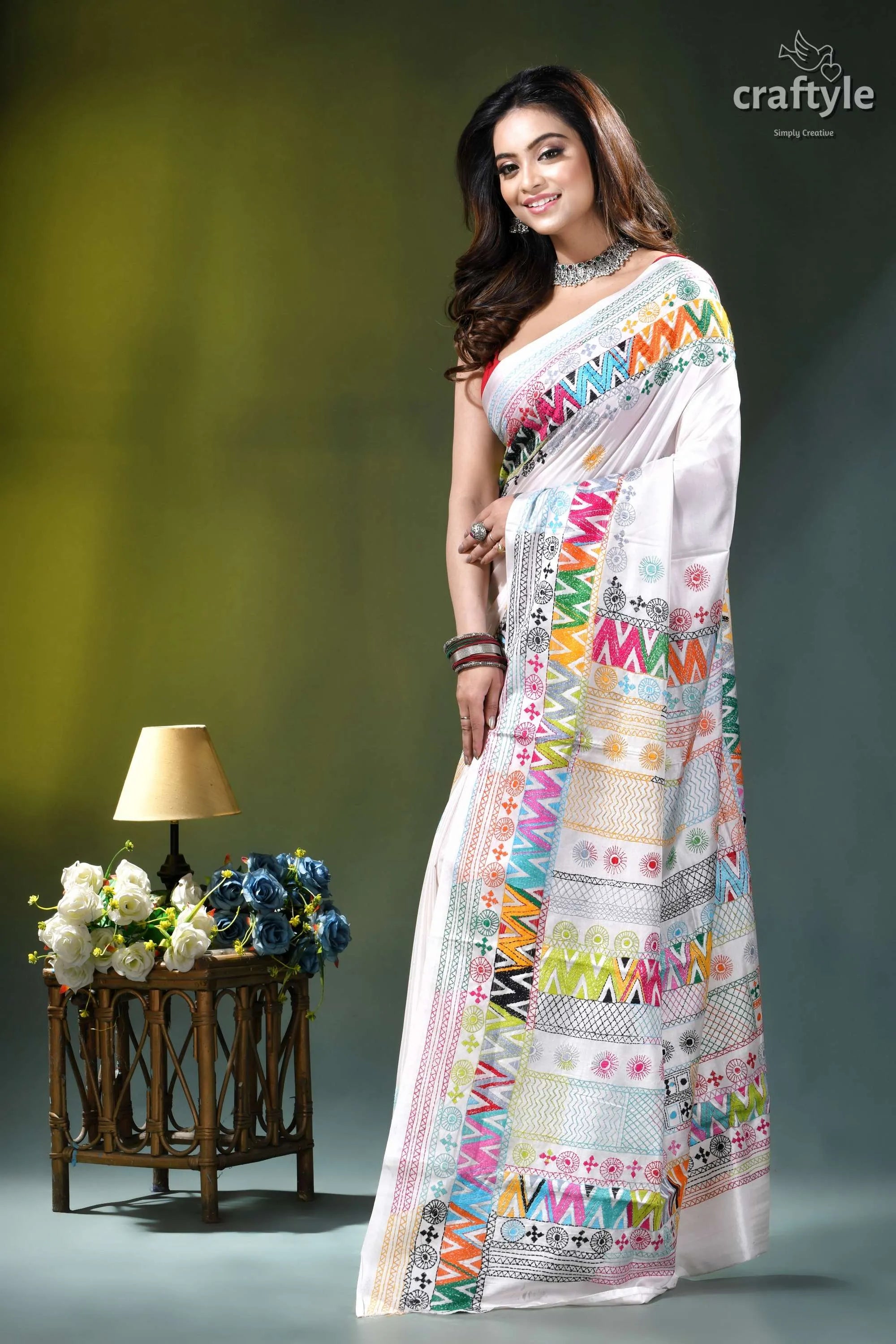Geometric pattern multicolor hand embroidery silk lambani saree in white white saree adorned vibrant multicolored 3