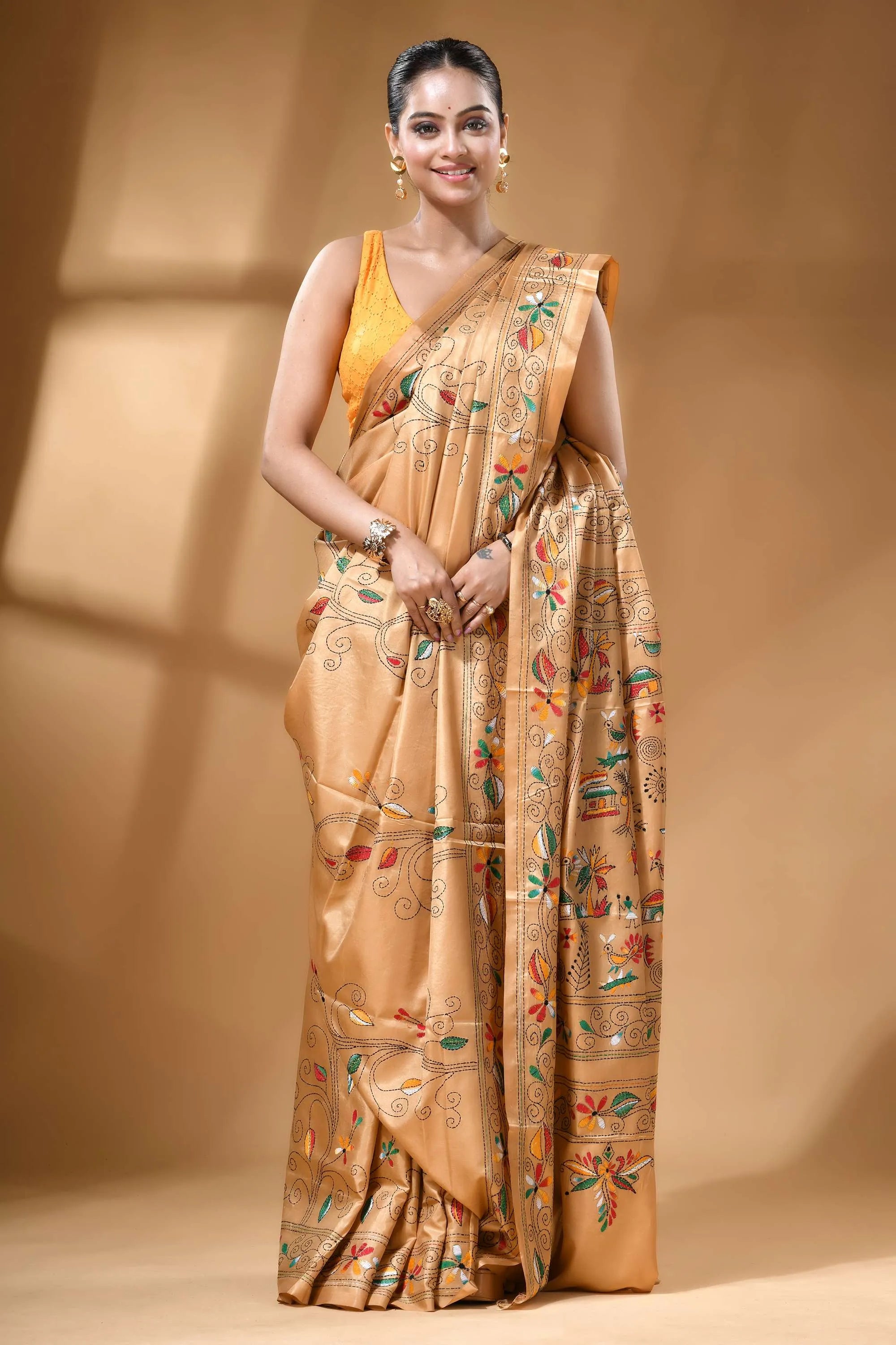 Golden beige handcrafted village theme multicolor silk kantha saree woman wears golden-brown silk saree 5