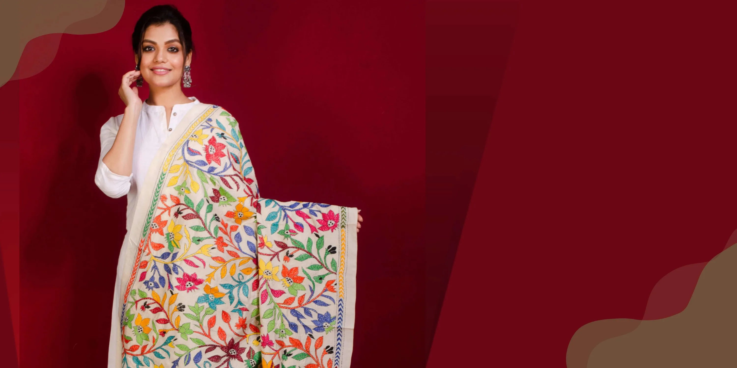 Woman in white dress with colorful floral shawl