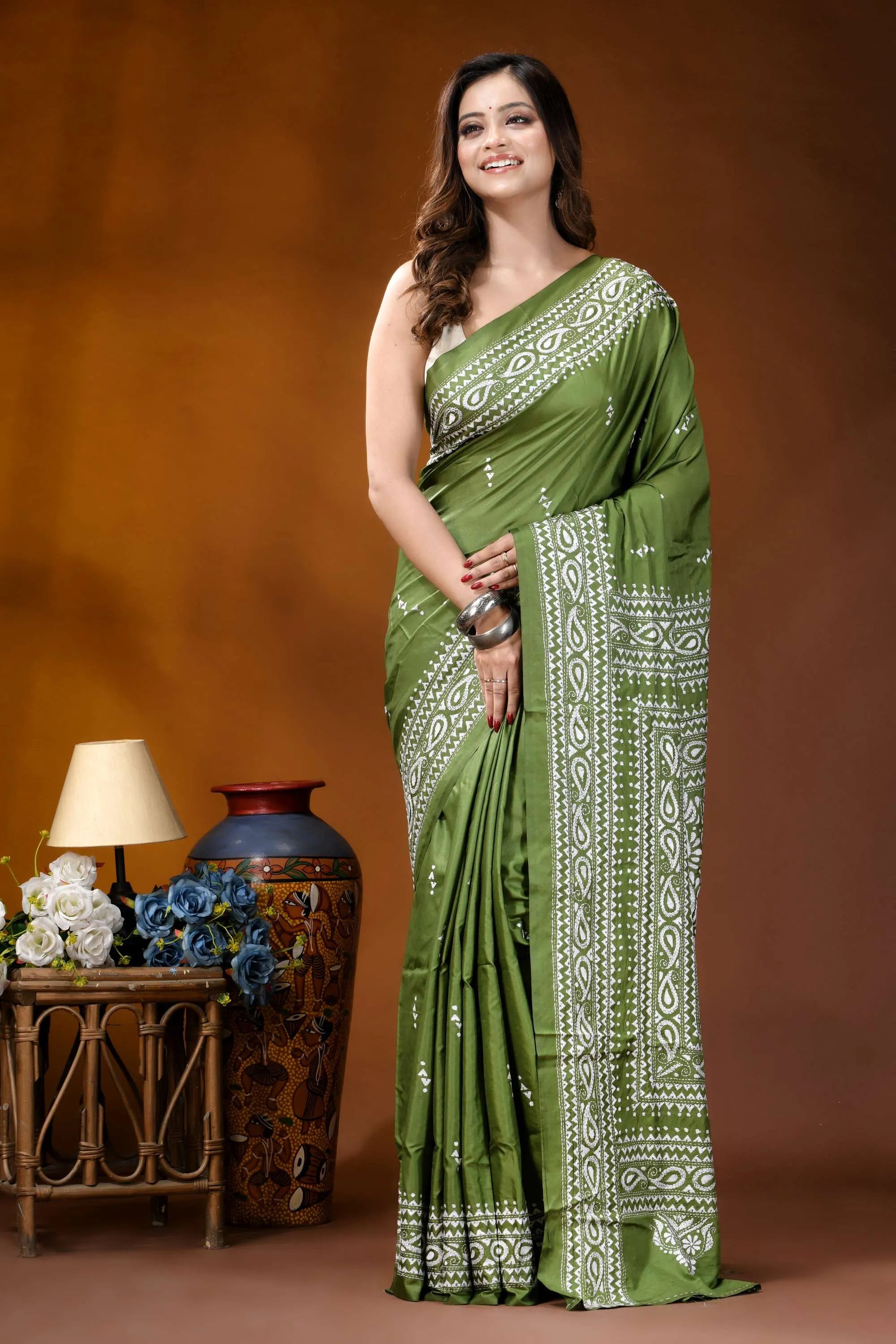Leaf green paisley design hand embroidery silk kantha stitch saree woman wears vibrant olive green 6