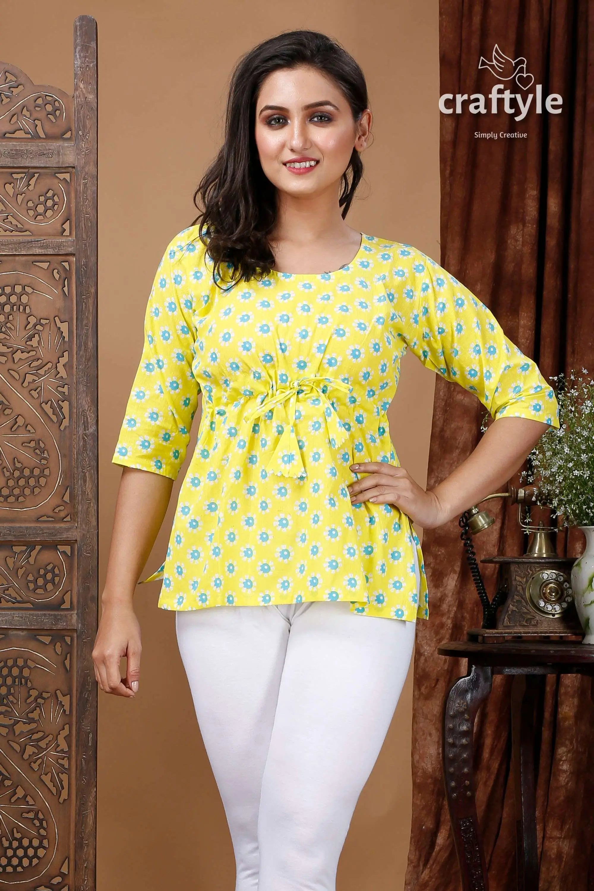 Lemon yellow cotton printed top with three quarter sleeves woman yellow patterned white leggings 2