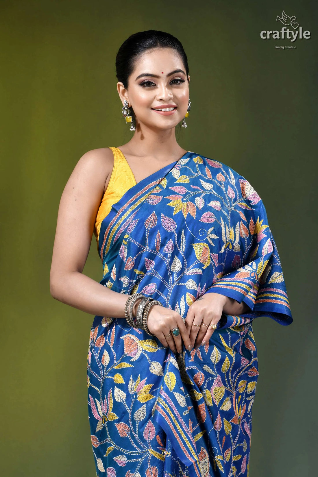 Medium blue multicolor lotus motif silk kantha stitch saree woman wears vibrant blue saree 2