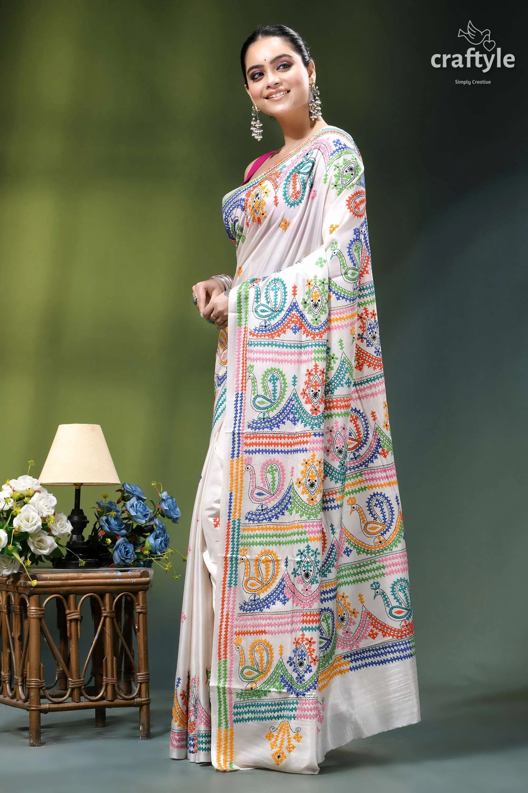 Milky white multithread kutch embroidery handmade silk saree woman wears cream-colored saree vibrant 3