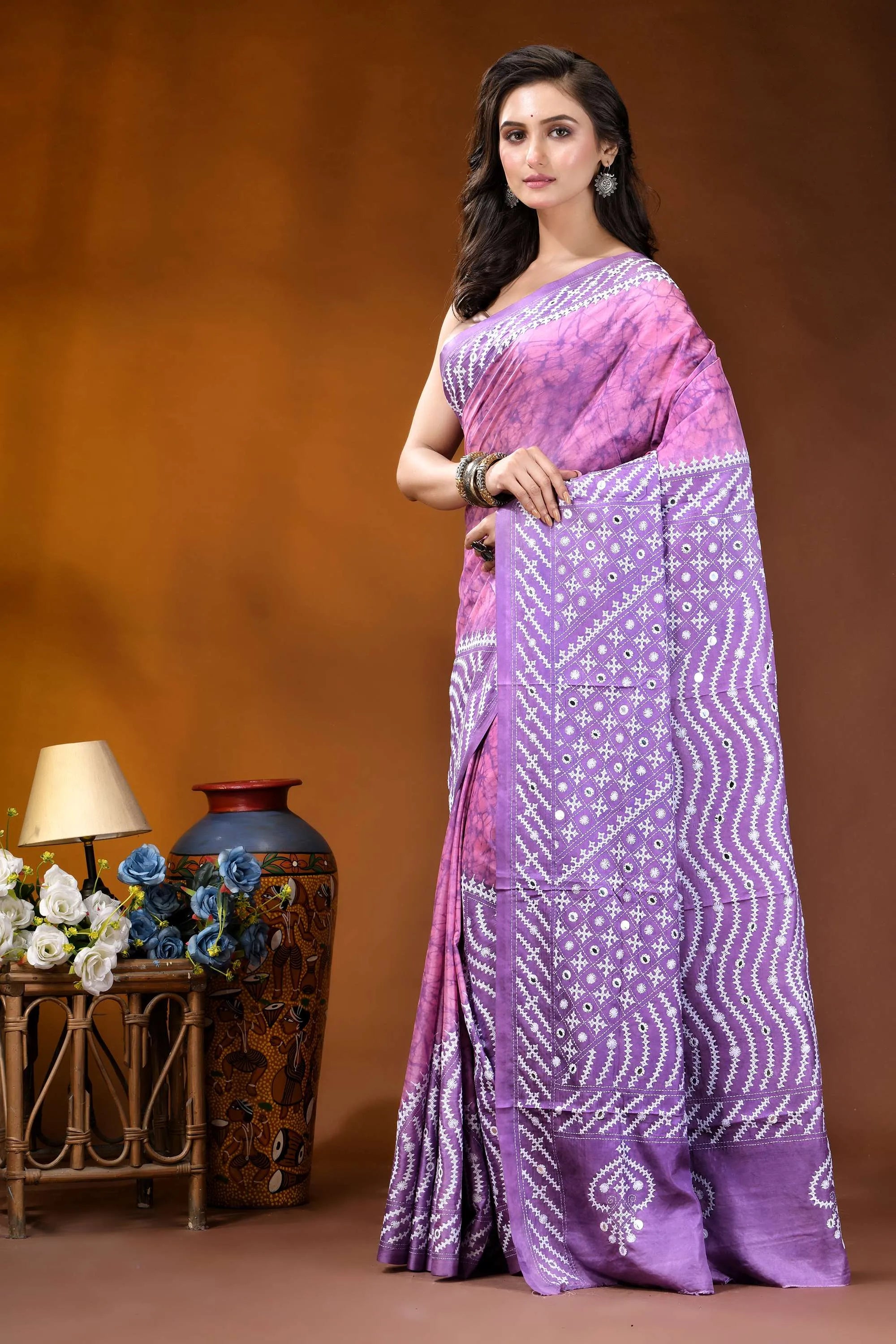 Mirror work geometric pattern hand batik gujarati stitch pink lavender dyed silk saree woman wears lavender purple