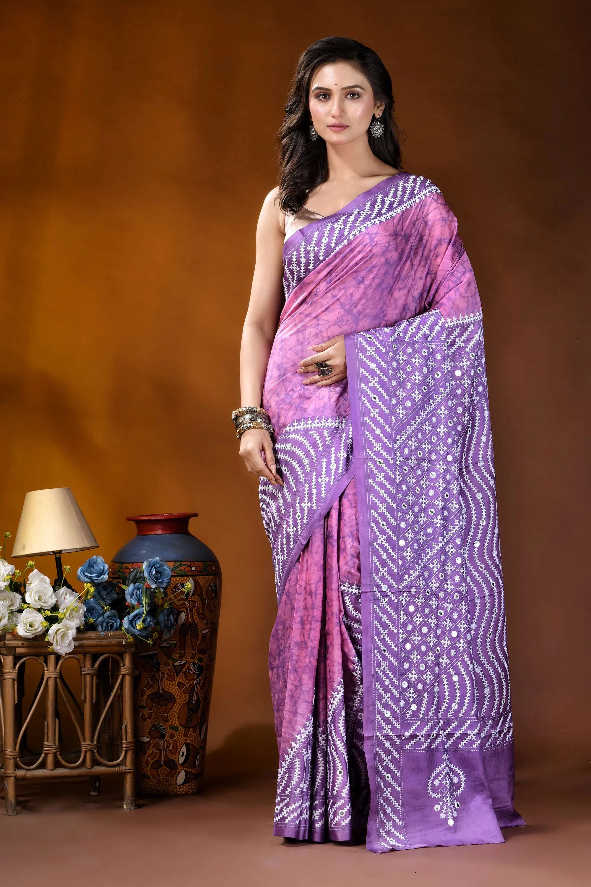 Mirror work geometric pattern hand batik gujarati stitch pink lavender dyed silk saree woman wears vibrant purple pink 1