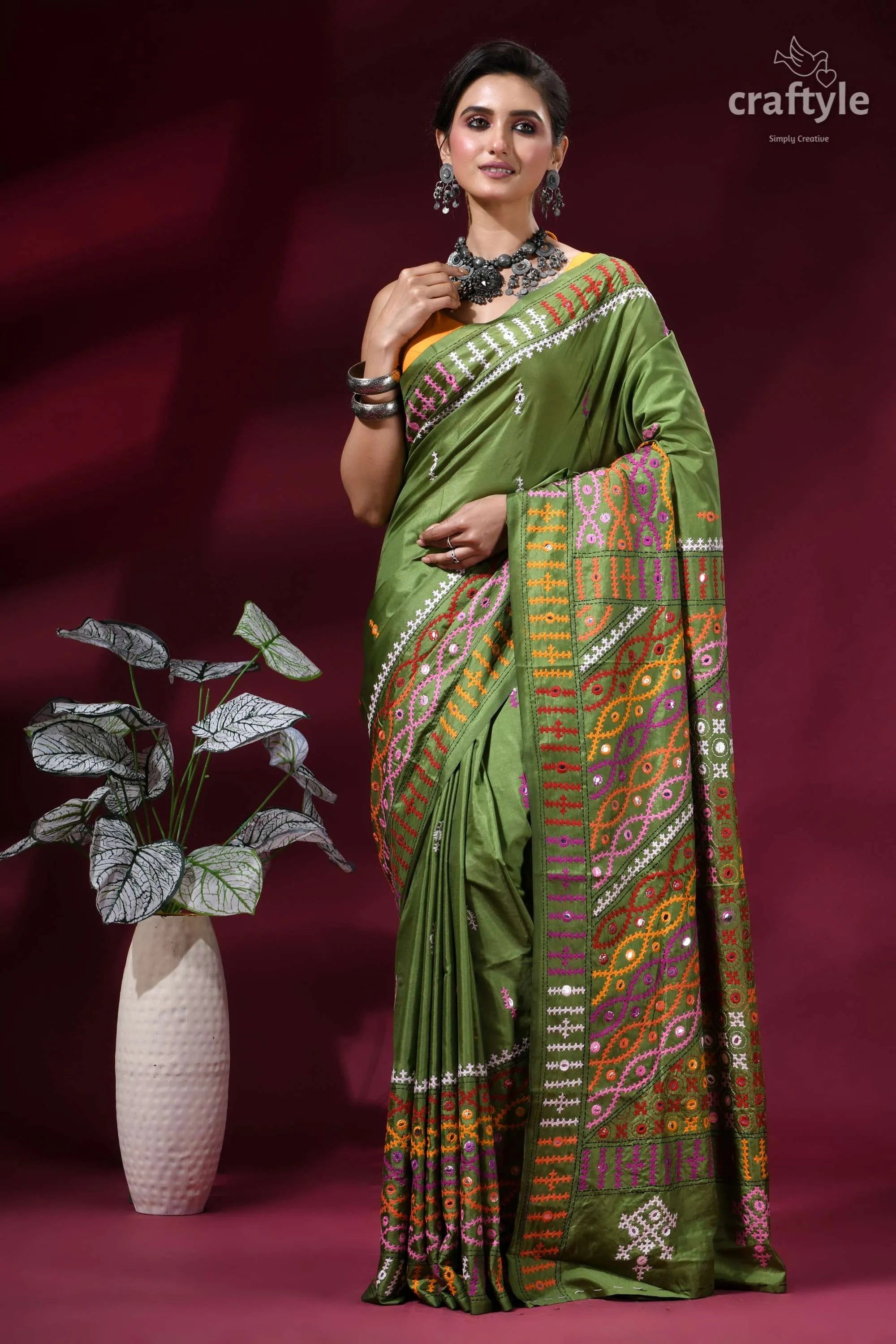 Muddy green dual-tone kutch work silk saree with mirror detailing vibrant olive green saree adorned 6