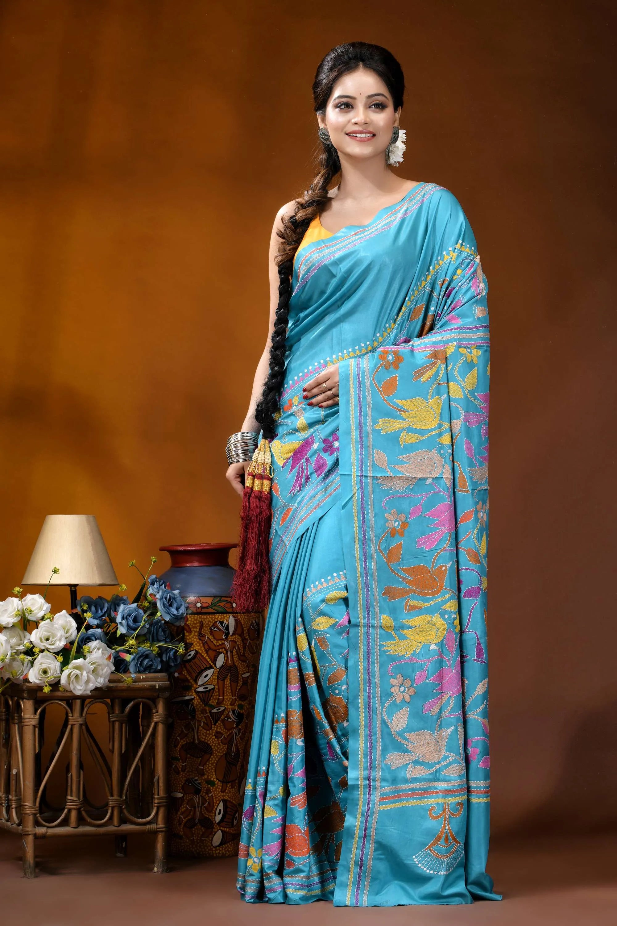 Multicolor bird design hand embroidered turquoise blue silk kantha saree woman wears vibrant turquoise saree 6
