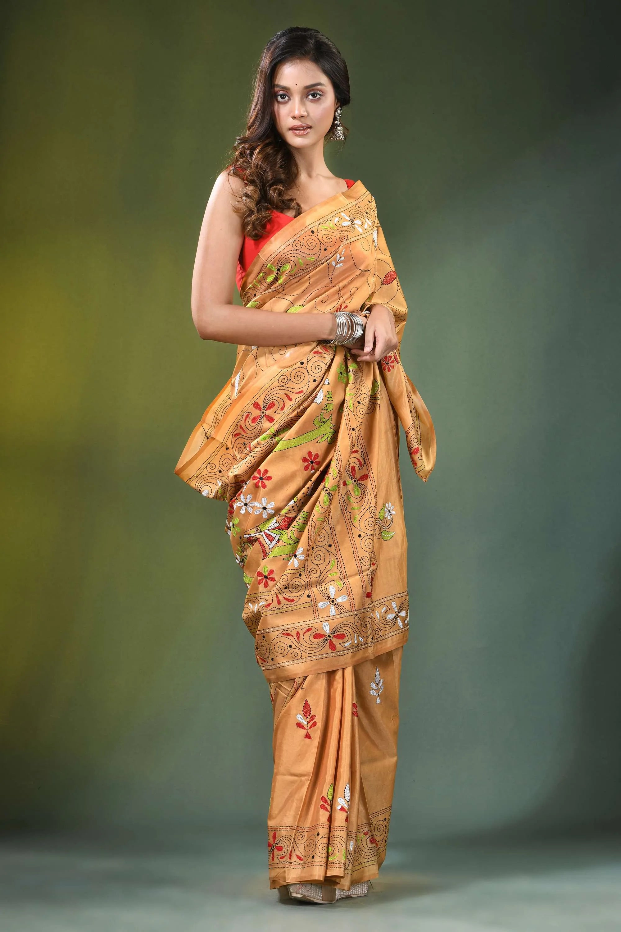 Peach hand embroidered folk art motif kantha embroidery silk saree woman wears golden-orange 4