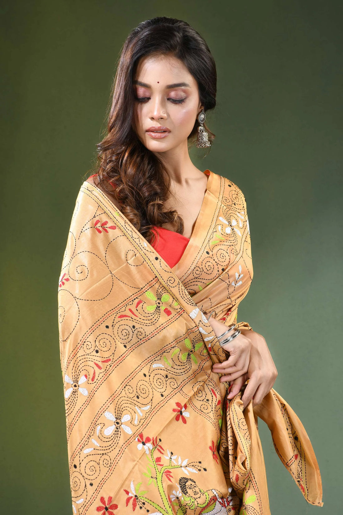 Peach hand embroidered folk art motif kantha embroidery silk saree woman wears golden-yellow intricate 2