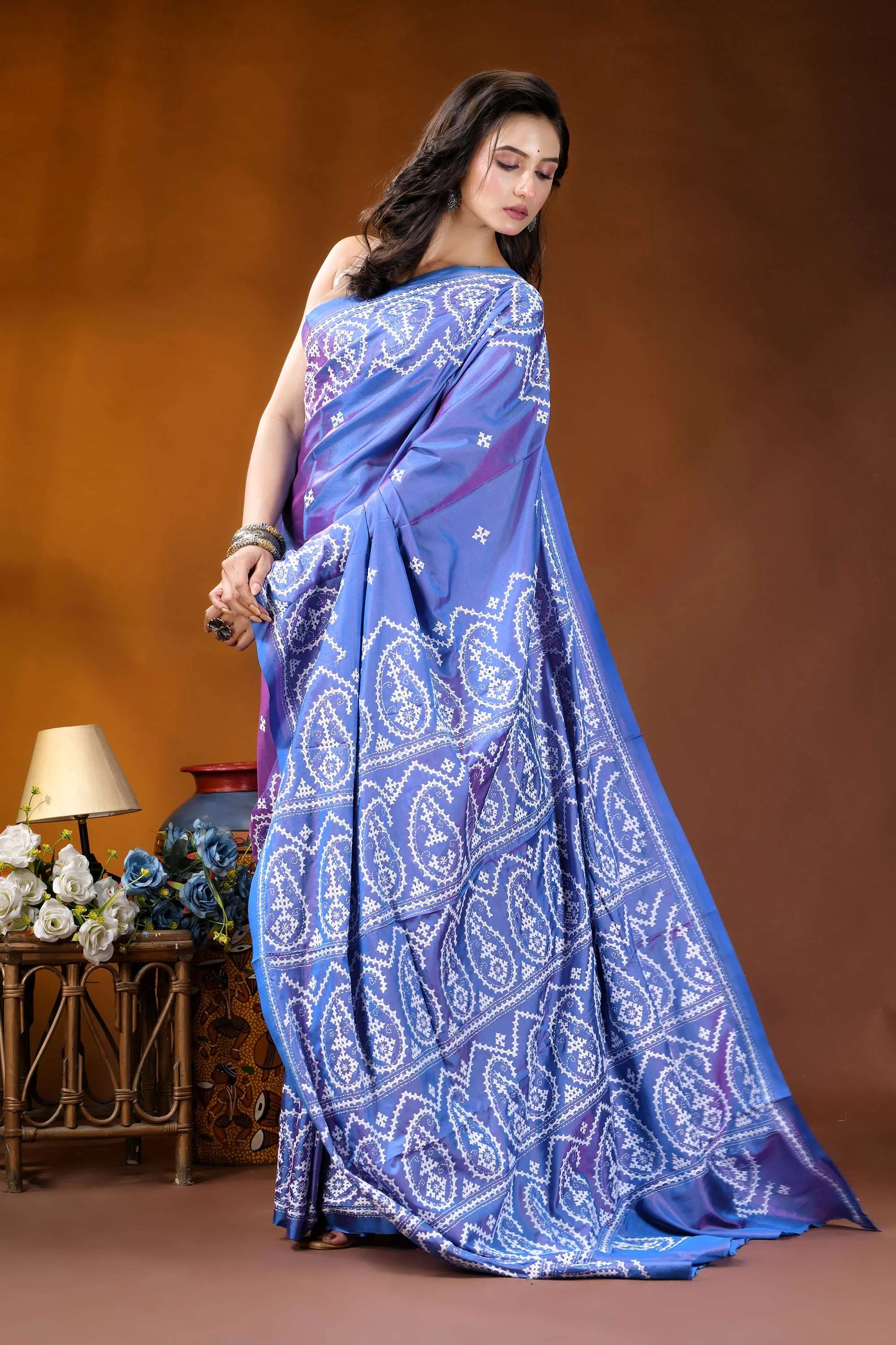 Periwinkle blue paisley motif handcrafted kutch embroidery silk saree woman wears vibrant blue saree 4