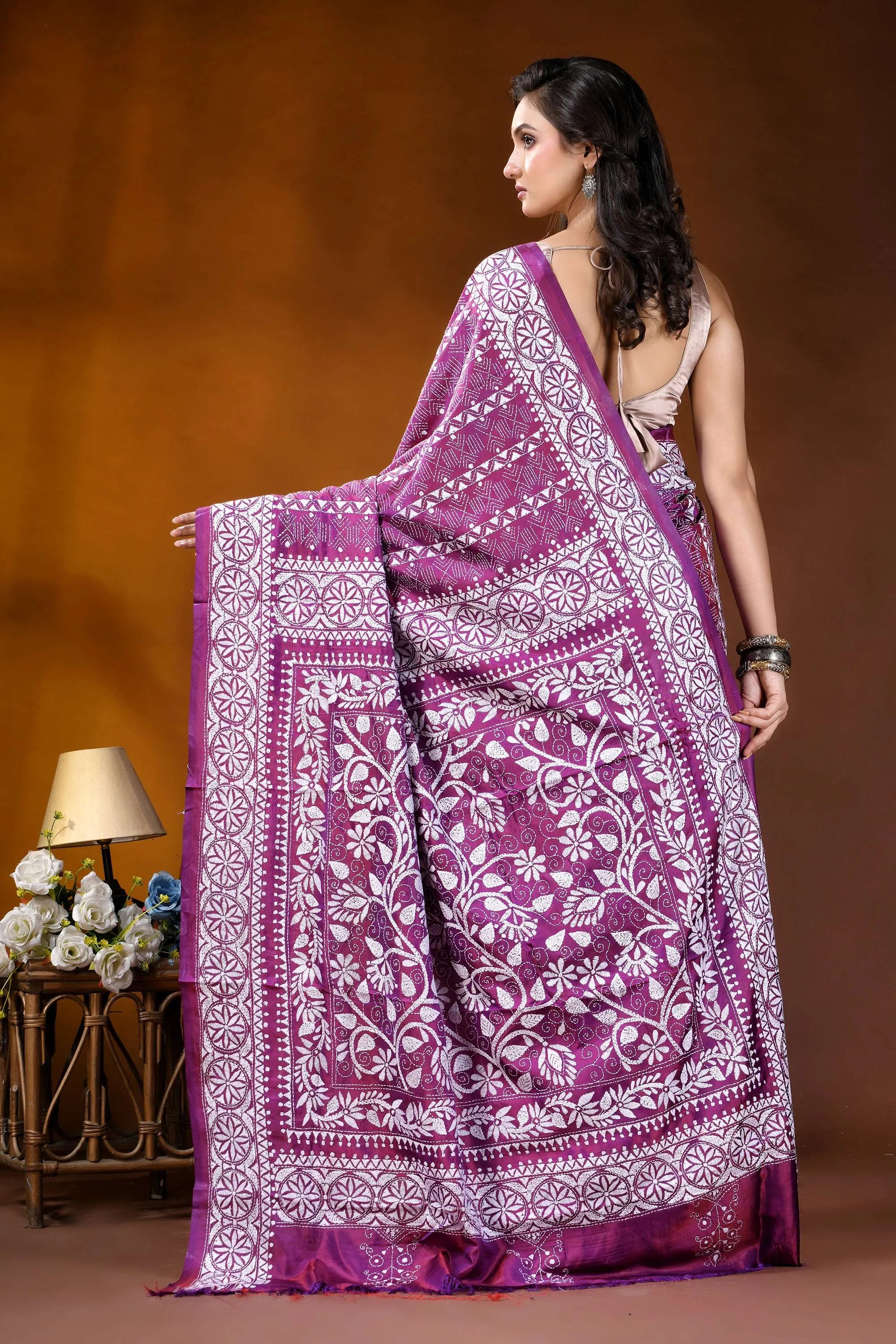 Plum floral design handcrafted silk kantha work saree woman wears vibrant purple white 5