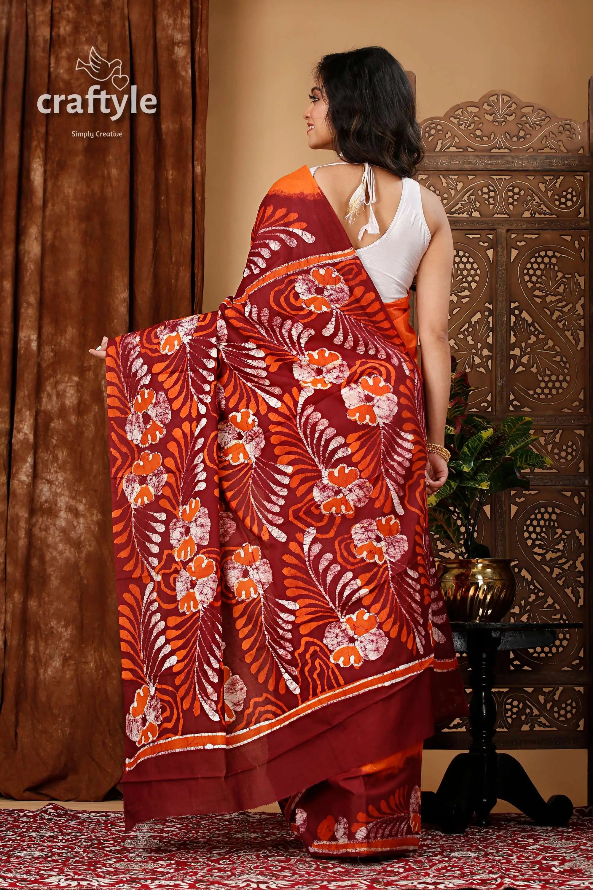 Premium cotton batik saree with alpana design - handcrafted luxury maroon orange floral batik saree 5