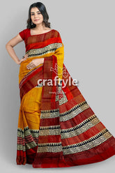 Saffron yellow pure tussar silk saree with hand block print and zari border yellow red saree geometric border 1