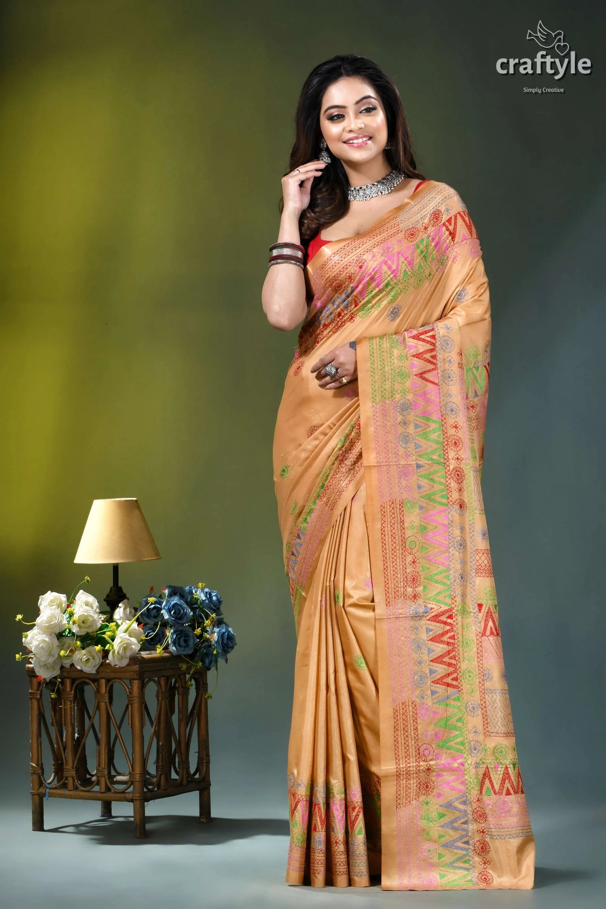 Sand brown silk saree with multi-thread lambani embroidery woman wears peach-colored silk saree 6