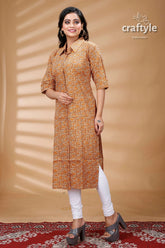 Sandy brown cotton ajrakh printed straight kurti with collar woman patterned kurta white leggings 4