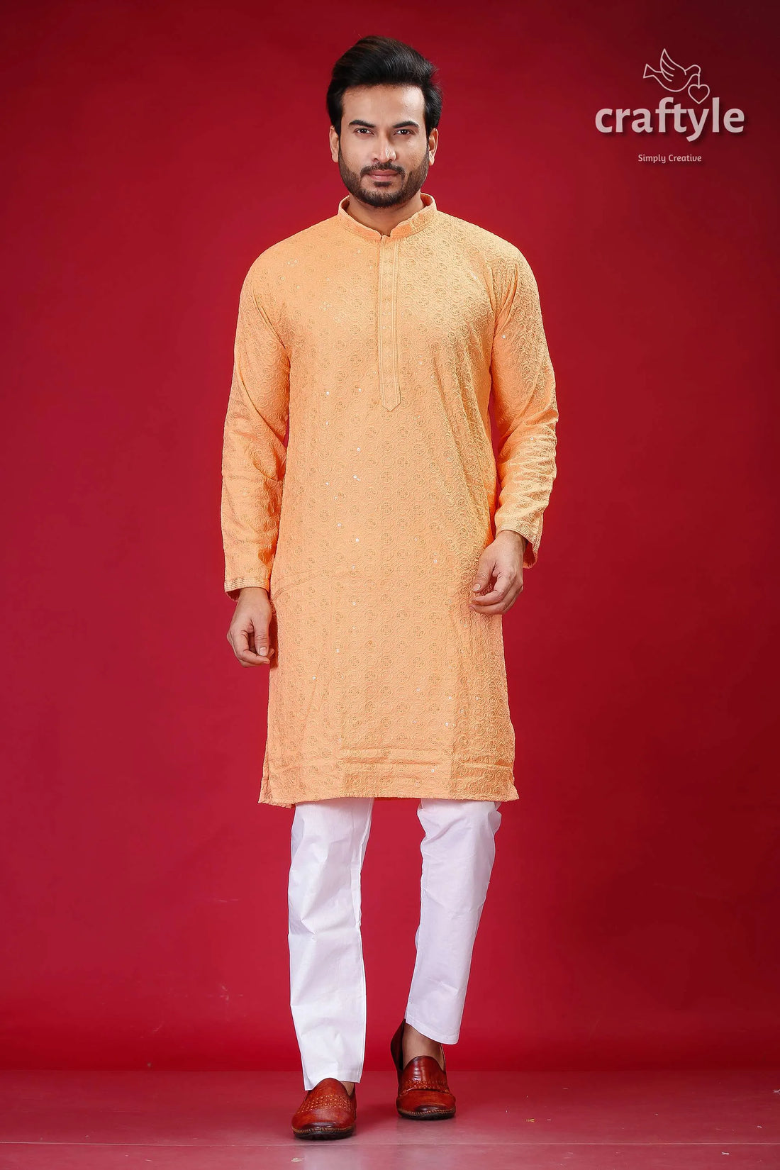 Sequin-embellished peach chikankari panjabi for men man orange kurta white pants 1