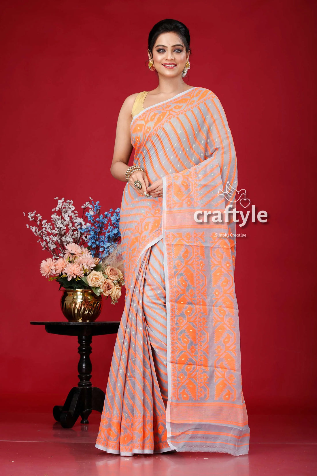 Smoke grey-orange jamdani weave saree woman patterned 1