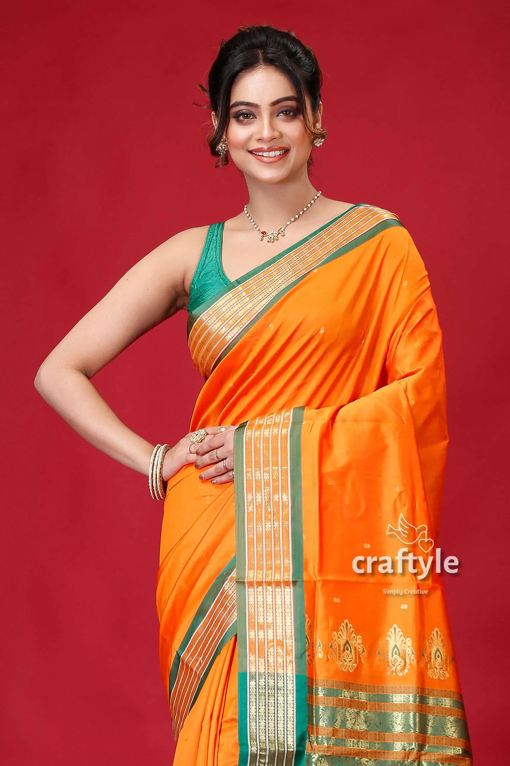 Spanish orange bomkai silk sari featuring golden zari border orange saree green gold border 2
