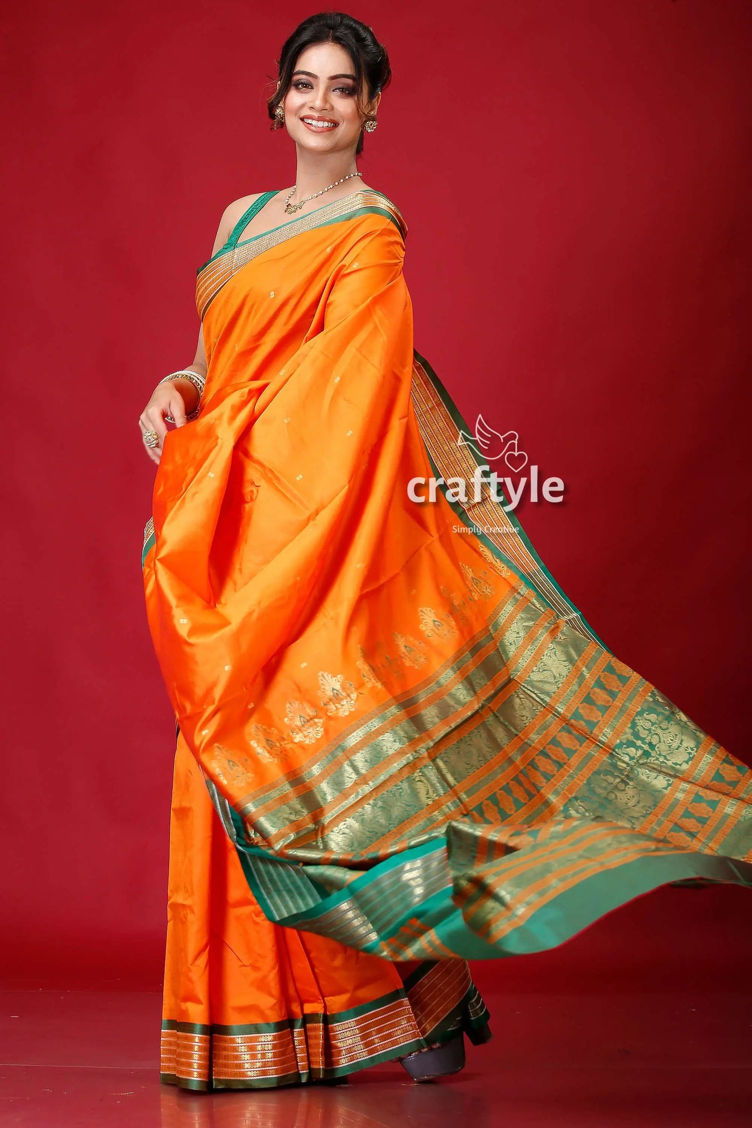 Spanish orange bomkai silk sari featuring golden zari border orange green silk saree 4