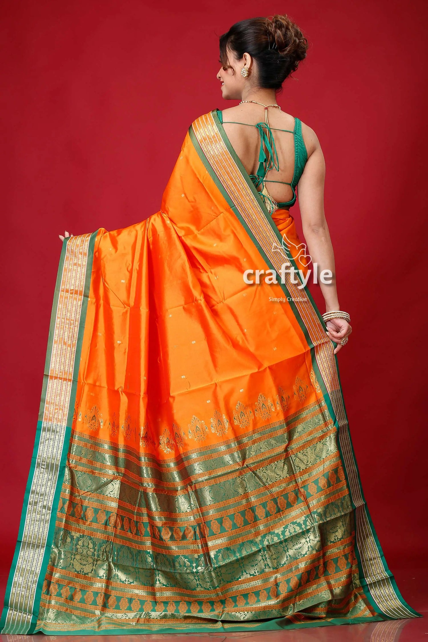 Spanish orange bomkai silk sari featuring golden zari border orange silk saree green gold 5