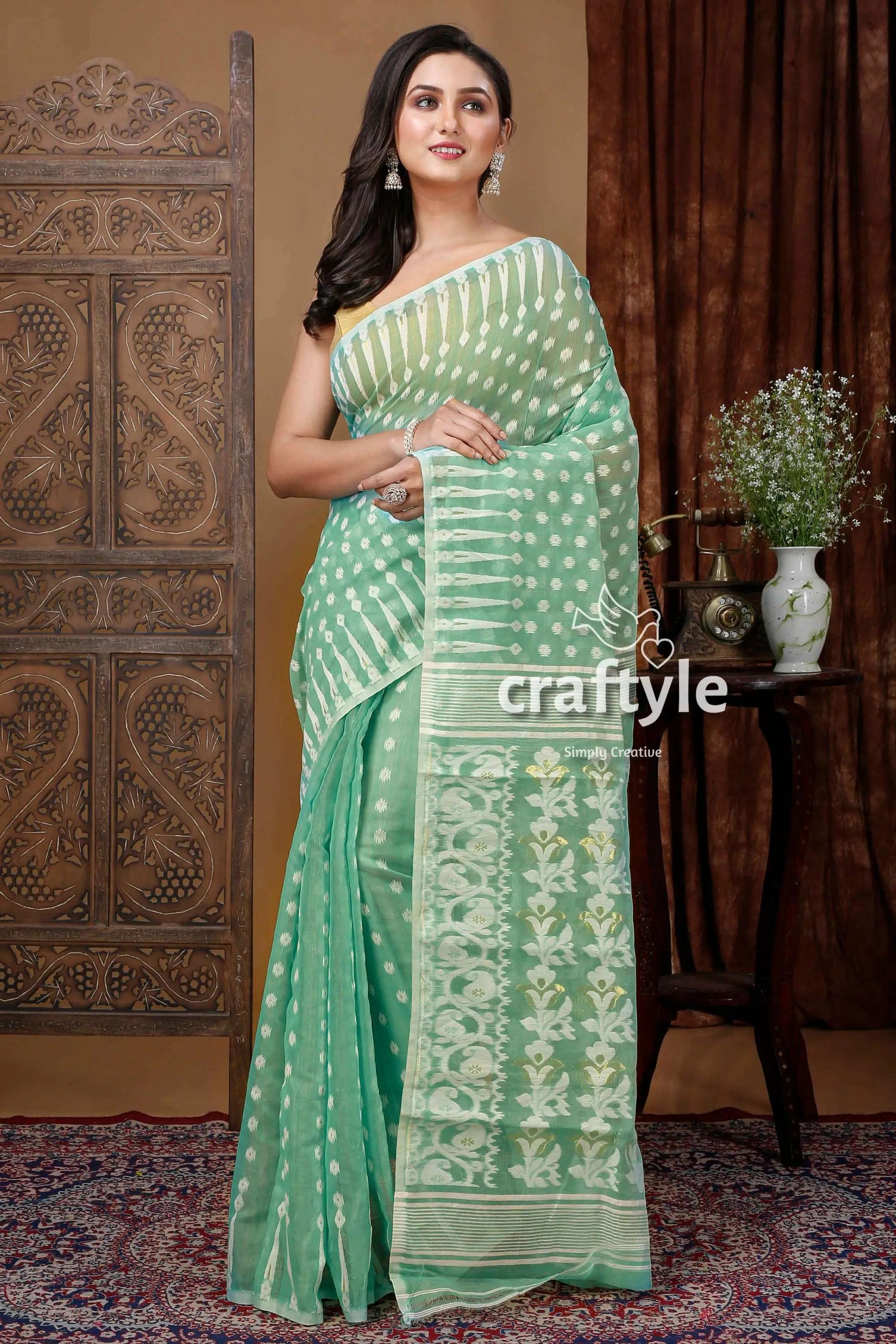 Stunning aquamarine green jamdani saree with white weave mint green patterned saree 1