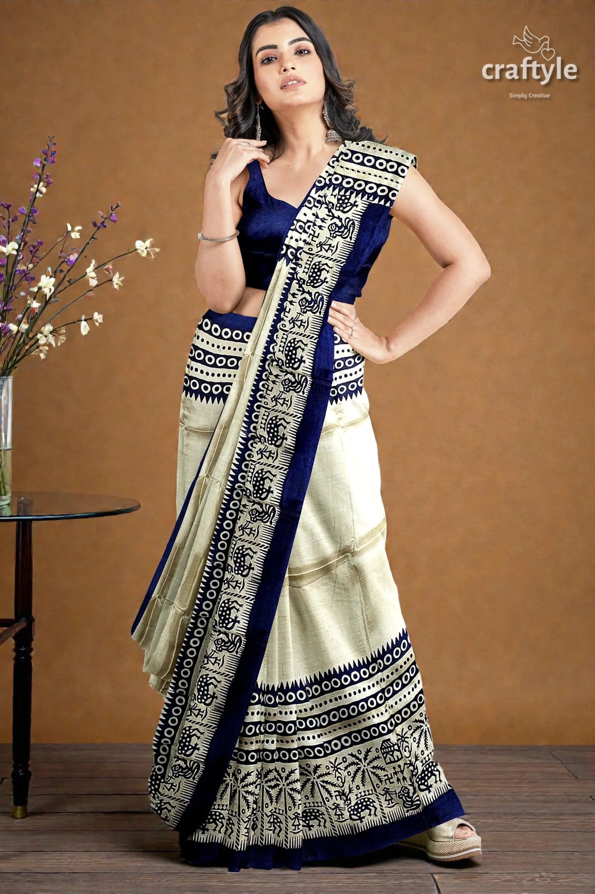 Stunning hand block print pure mulberry silk saree - black white woman wears navy blue cream-colored 3