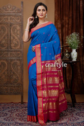 Ultramarine blue gadwal silk saree with zari border and butta design blue saree red gold border 1
