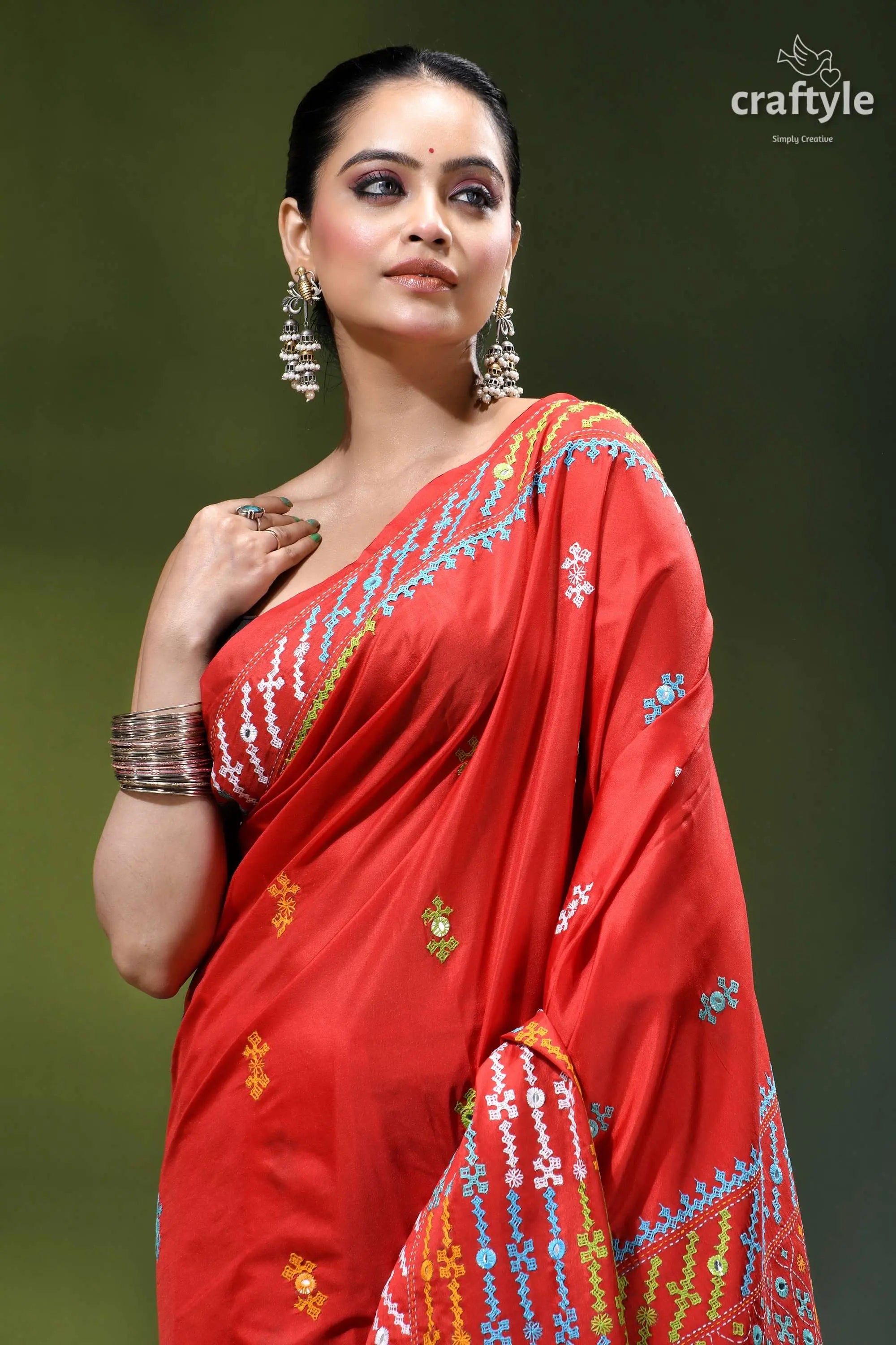 Vivid red intricate gujrati embroidery silk saree with mirror work vibrant red silk saree adorned 2