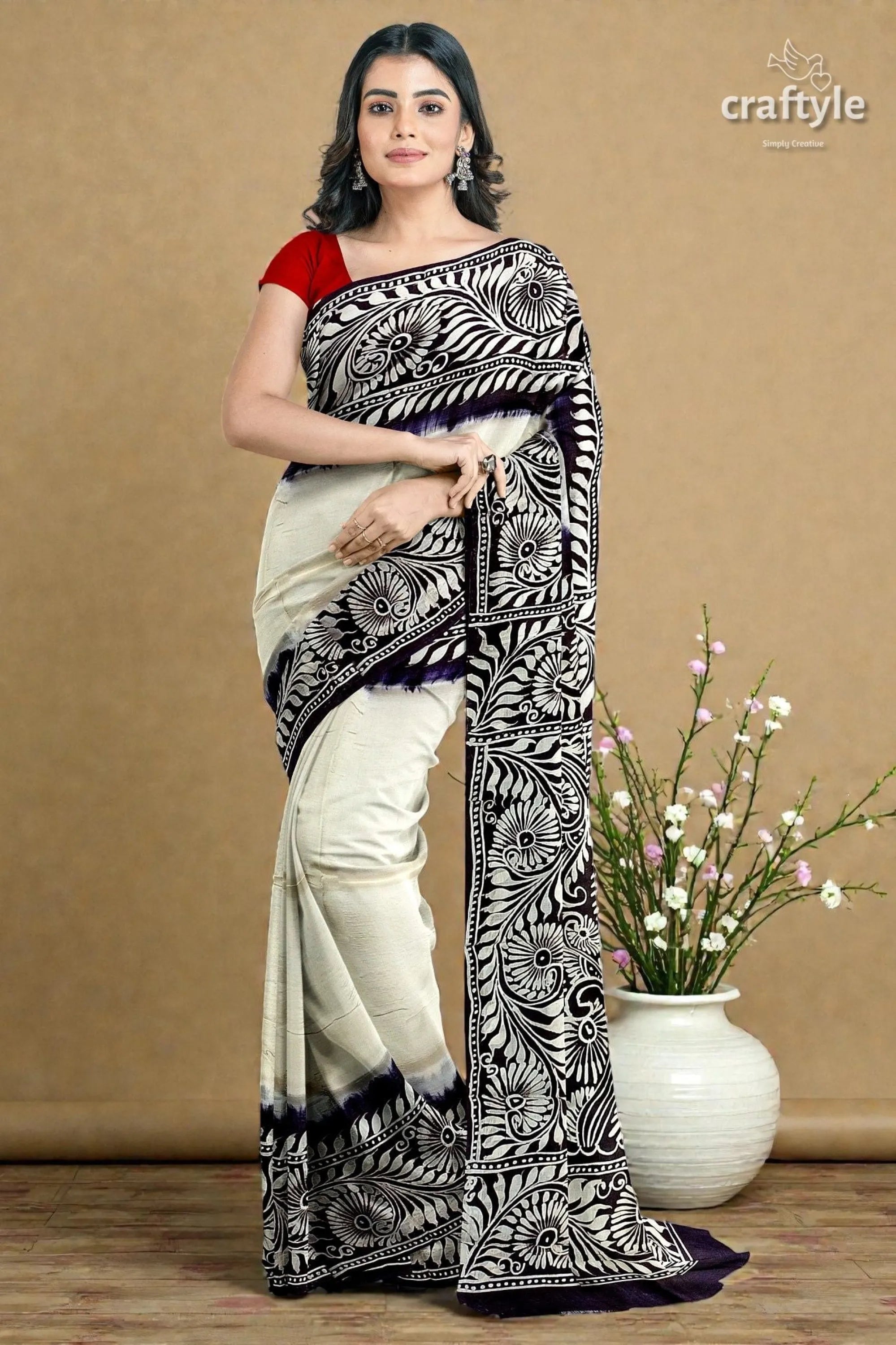 White and black soru tuli hand batik mulberry pure silk saree woman wears cream black floral-patterned 3