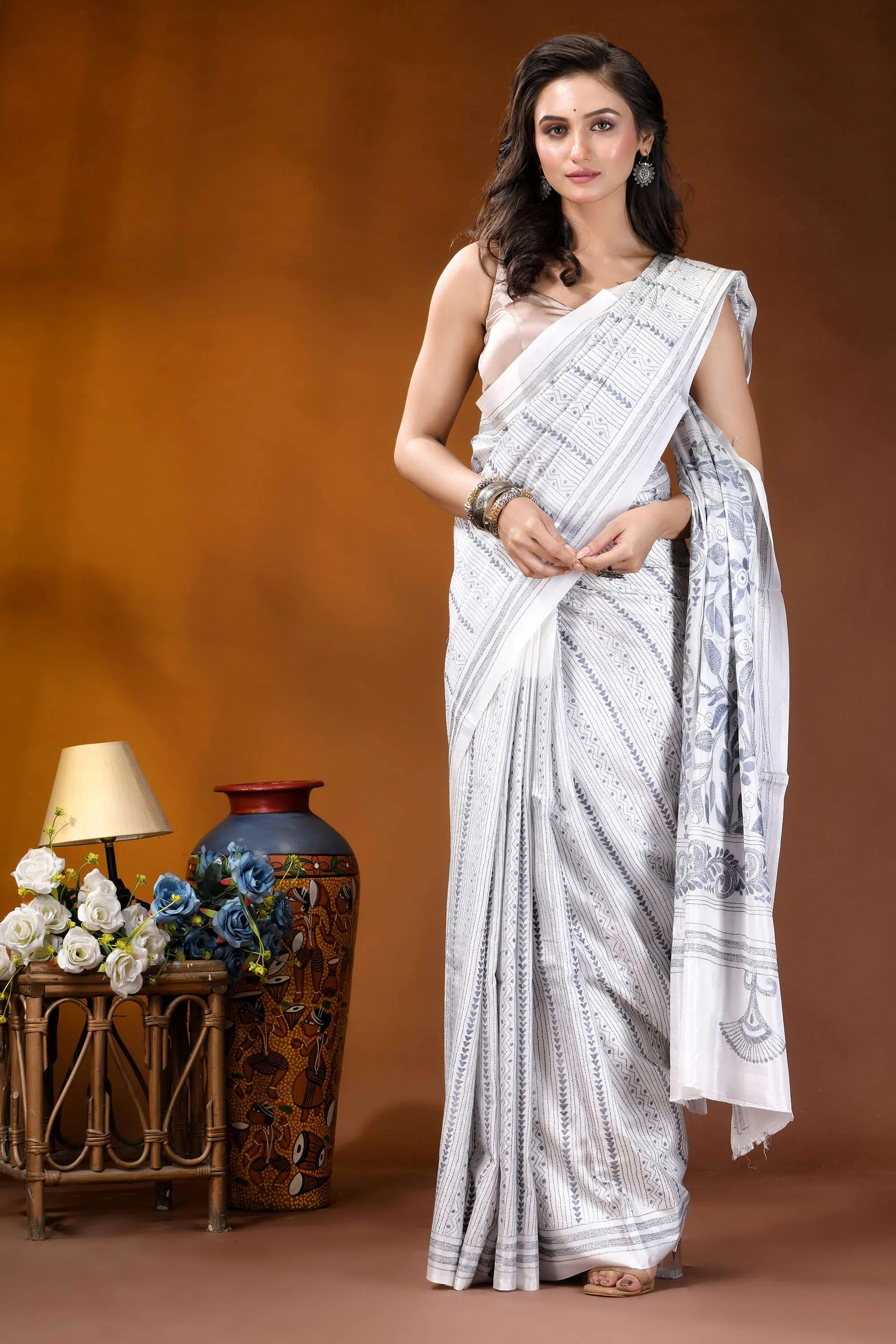 White floral leaf motif hand embroidered kantha silk saree woman wears white saree intricate 5