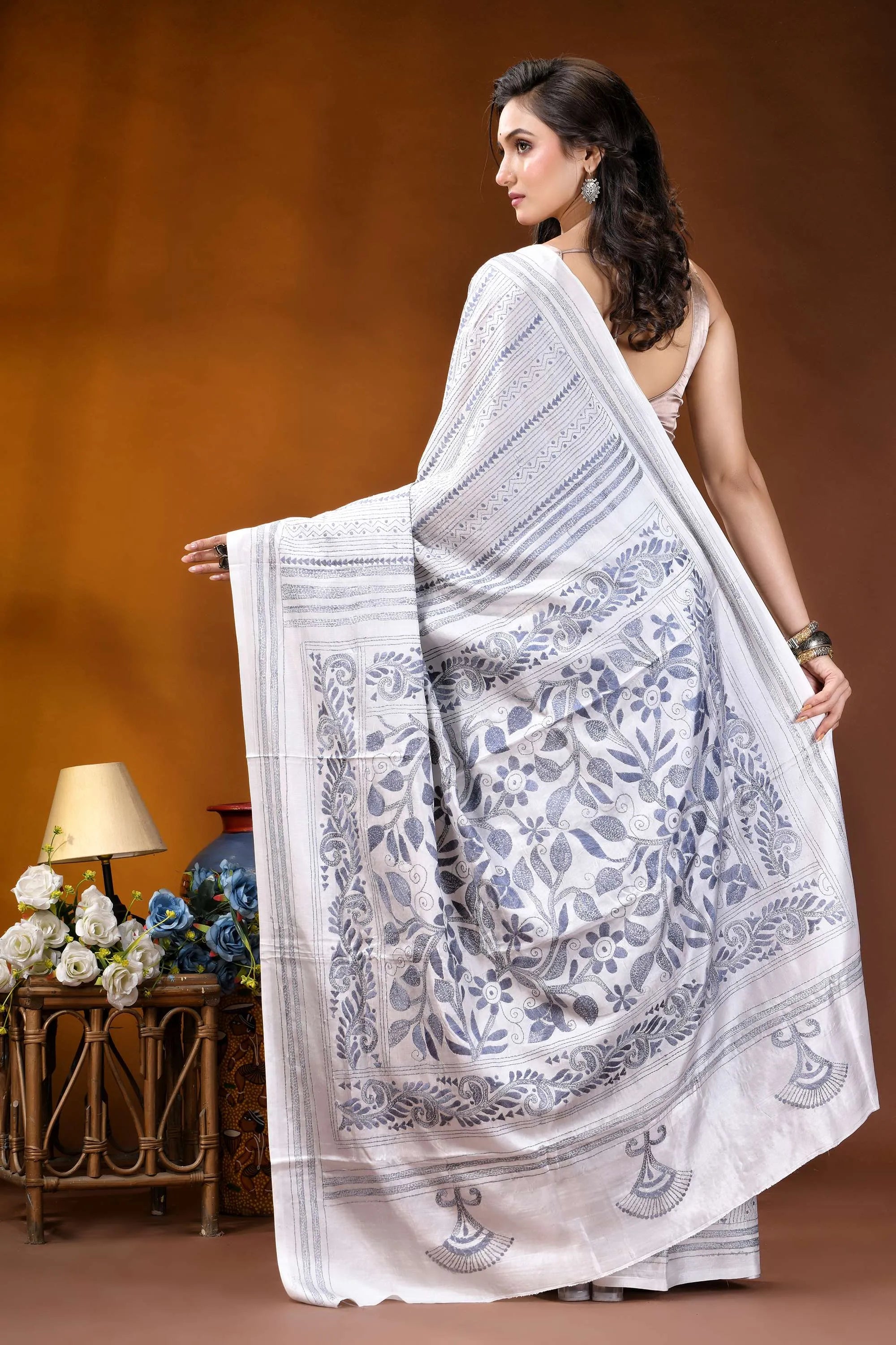 White floral leaf motif hand embroidered kantha silk saree woman wears white saree intricate 6