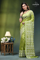 Android green hand kutch embroidery heritage silk saree woman wears vibrant olive green 6