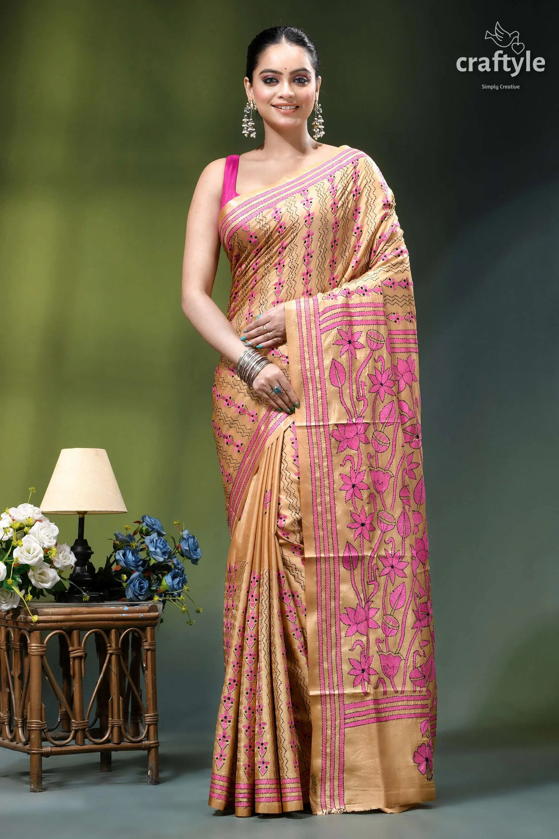 Artisanal lotus design sorrel brown silk kantha stitch saree woman wears peach-colored saree vibrant 1