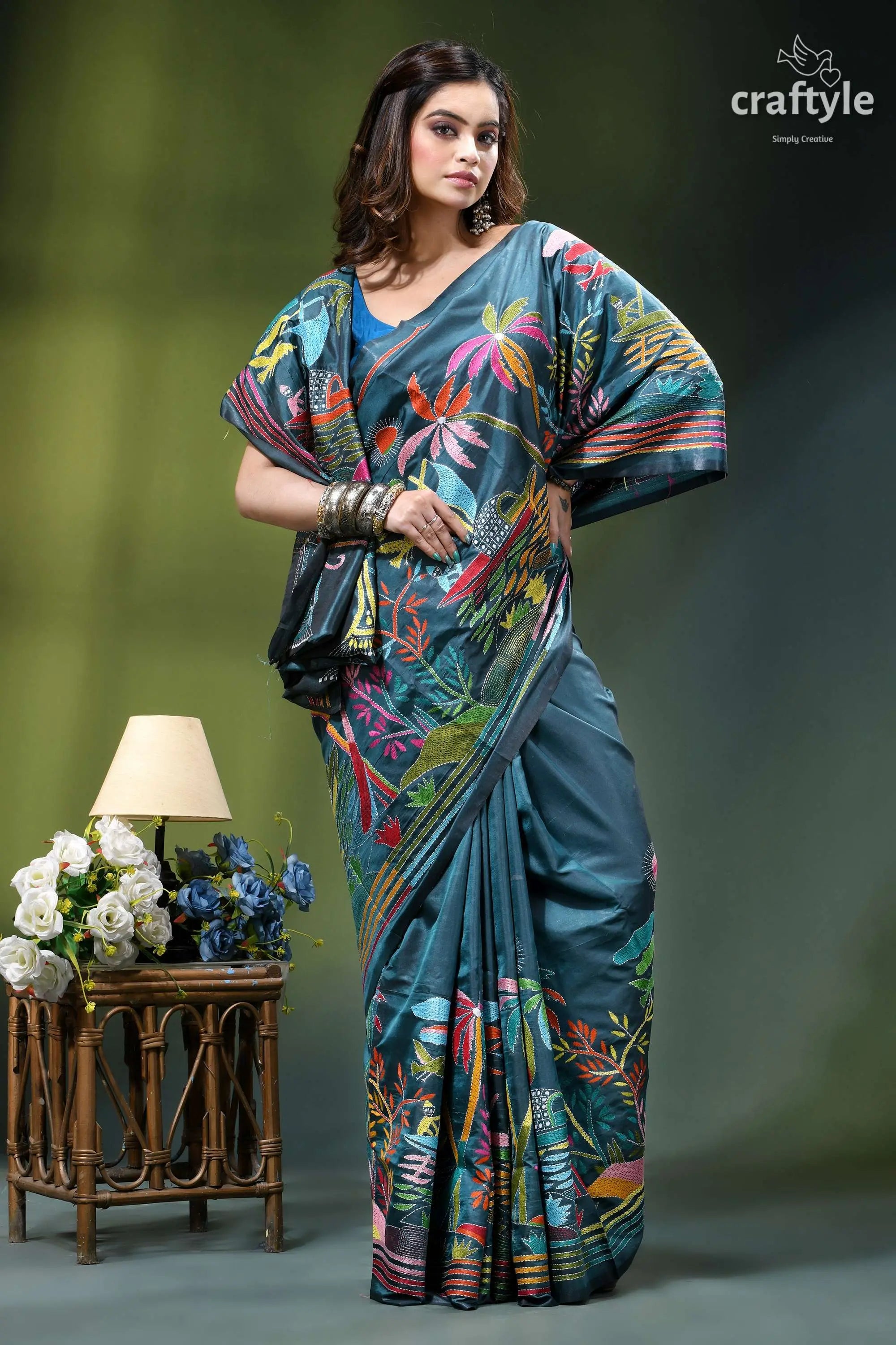 Artisanal nature theme exquisite silk kantha saree in teal blue woman wears teal silk saree 4