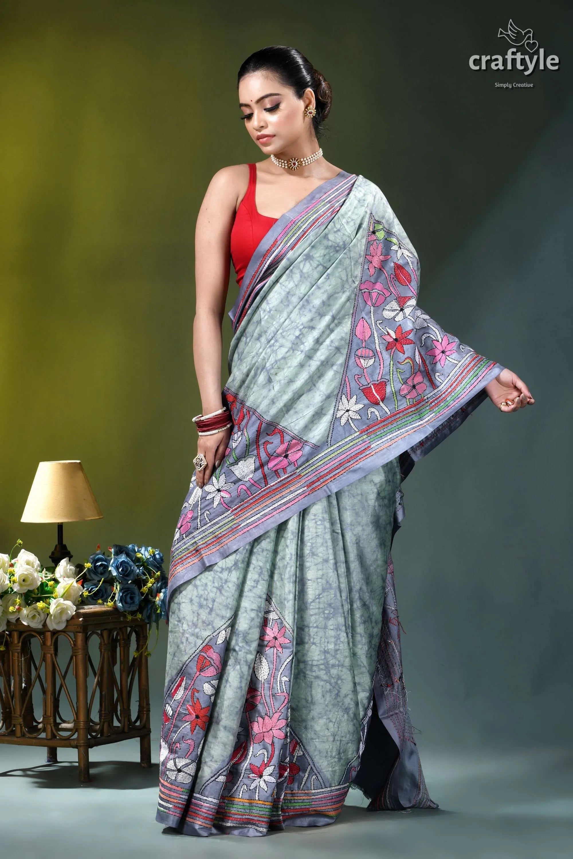 Beautiful floral motif hand batik silk kantha saree in opal woman wears light gray saree 5