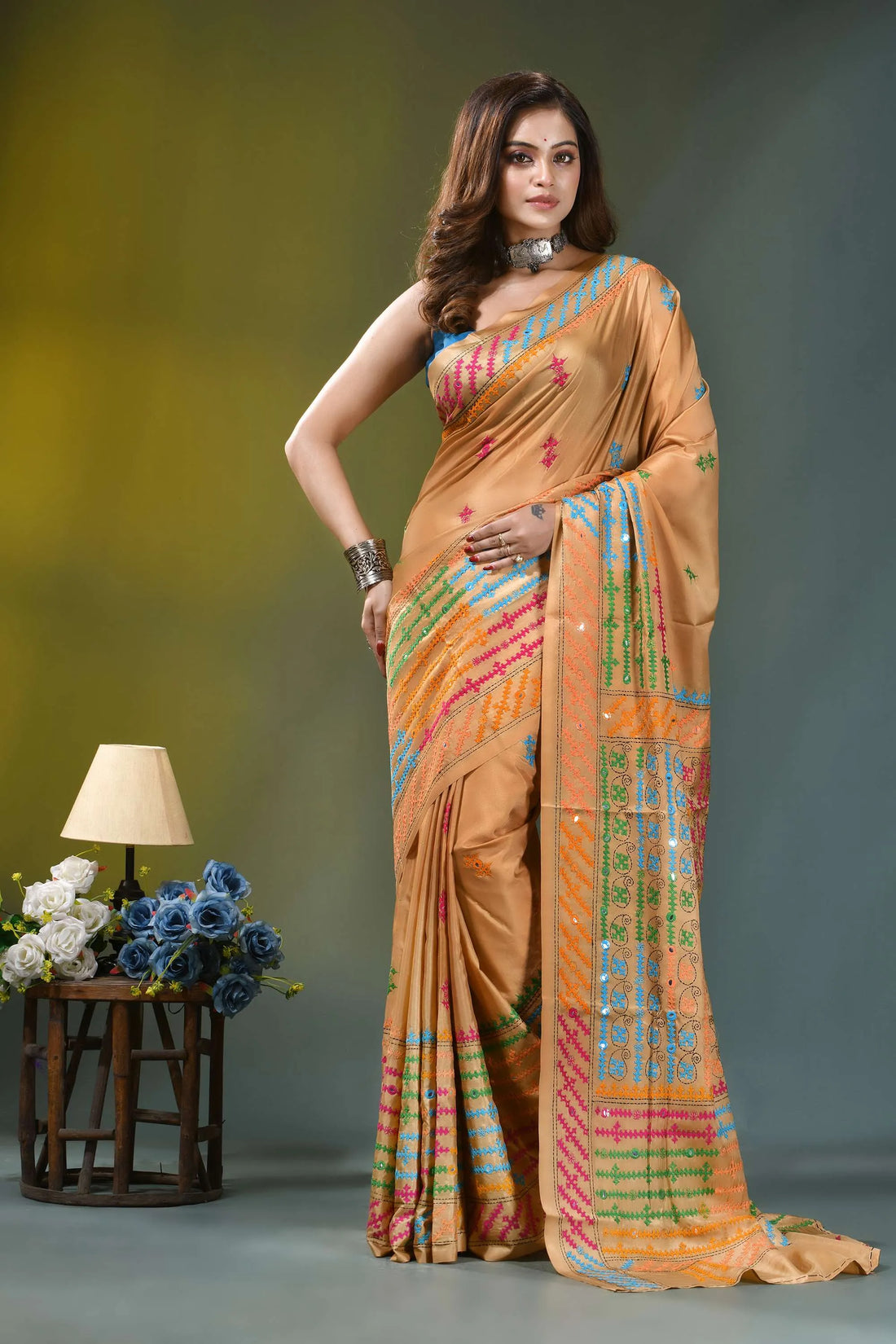 Beige gold multicolor thread hand kutch embroidered silk saree - mirror work woman wears peach-colored silk saree 1