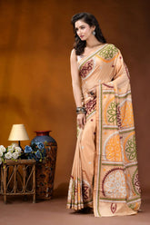 Beige multi-thread floral motif kutch embroidery silk saree woman wears peach-colored saree intricate 3