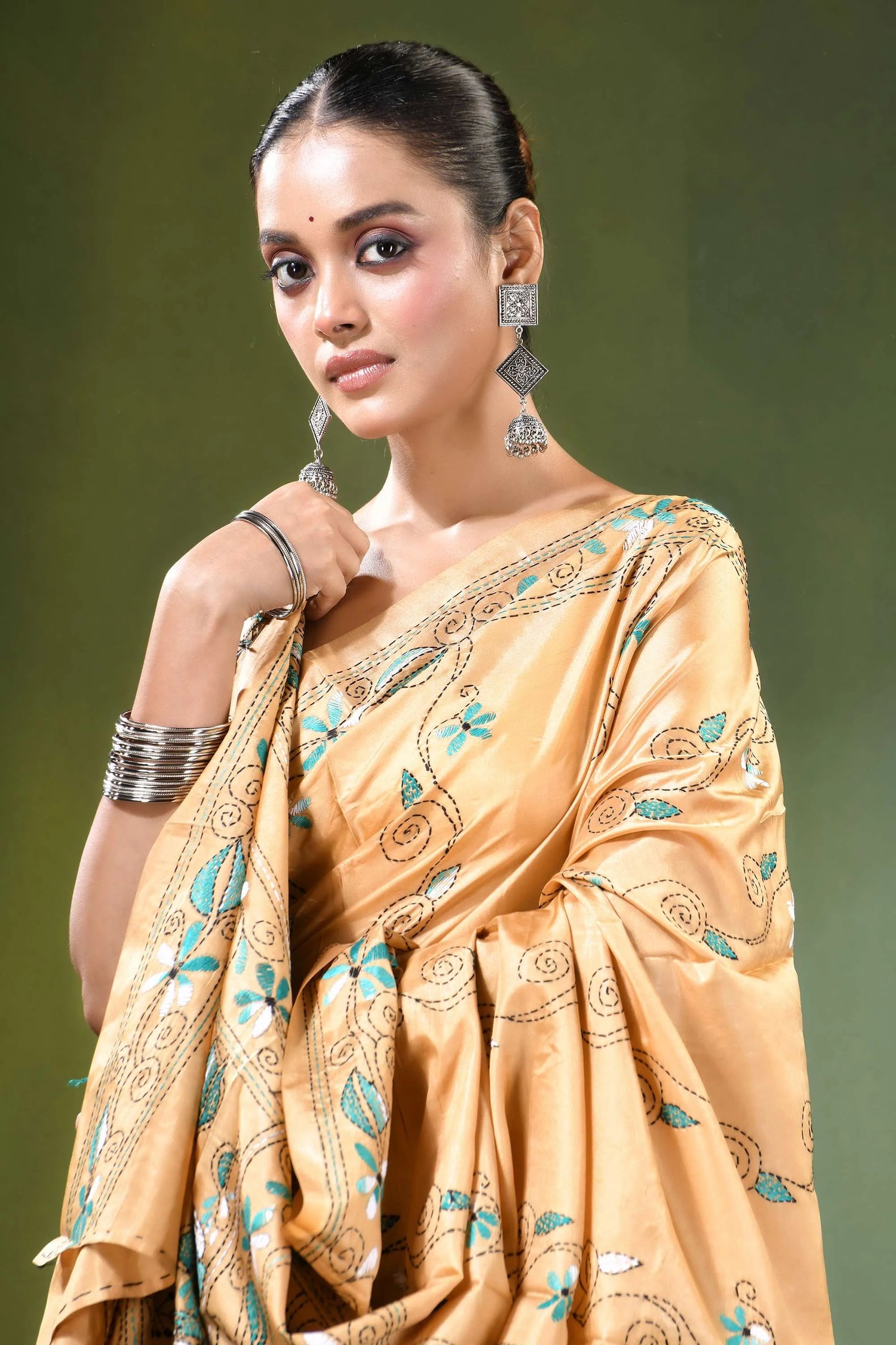 Beige village theme handcrafted silk kantha saree woman wears golden-yellow 2