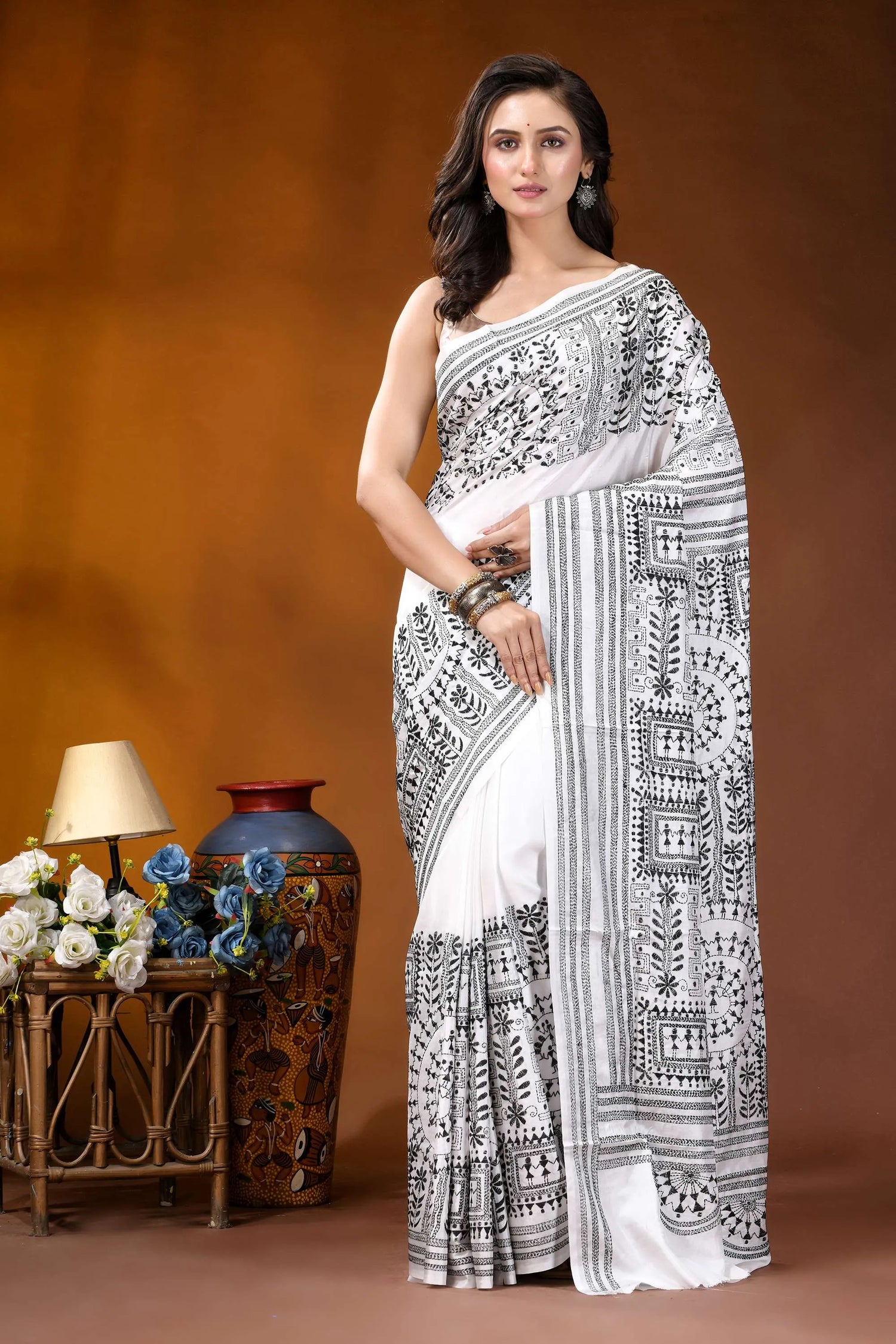 Black thread warli motif hand embroidered silk kantha saree in white woman wears white saree intricate 1