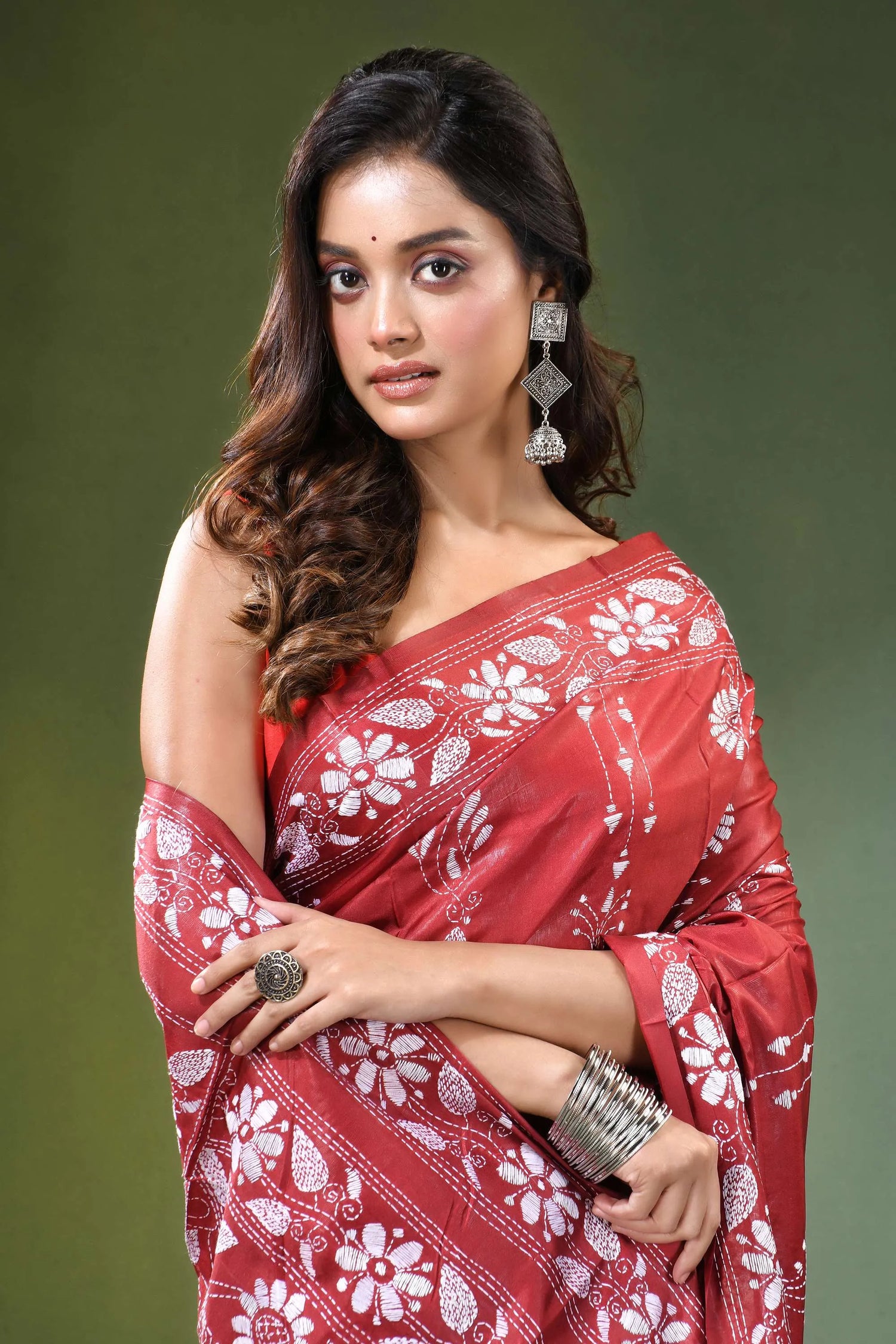 Brick red floral design handcrafted silk kantha stitch saree woman wears vibrant 2