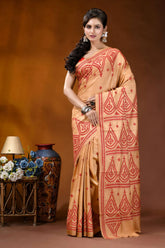 Burning sand ethnic motif hand embroidered silk kutch work saree woman wears peach-colored saree intricate 1